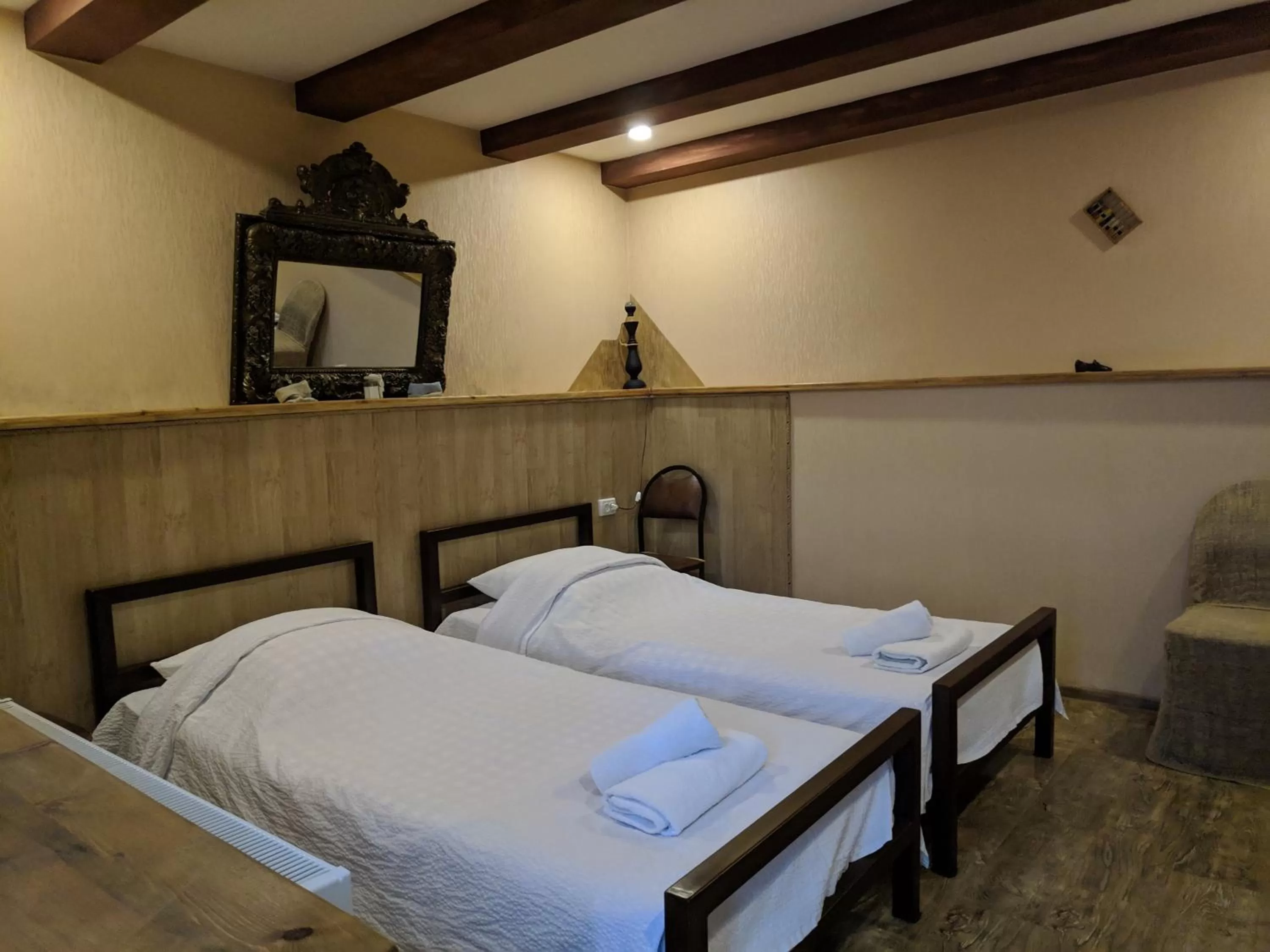 Bed in Qilimcha's Guesthouse