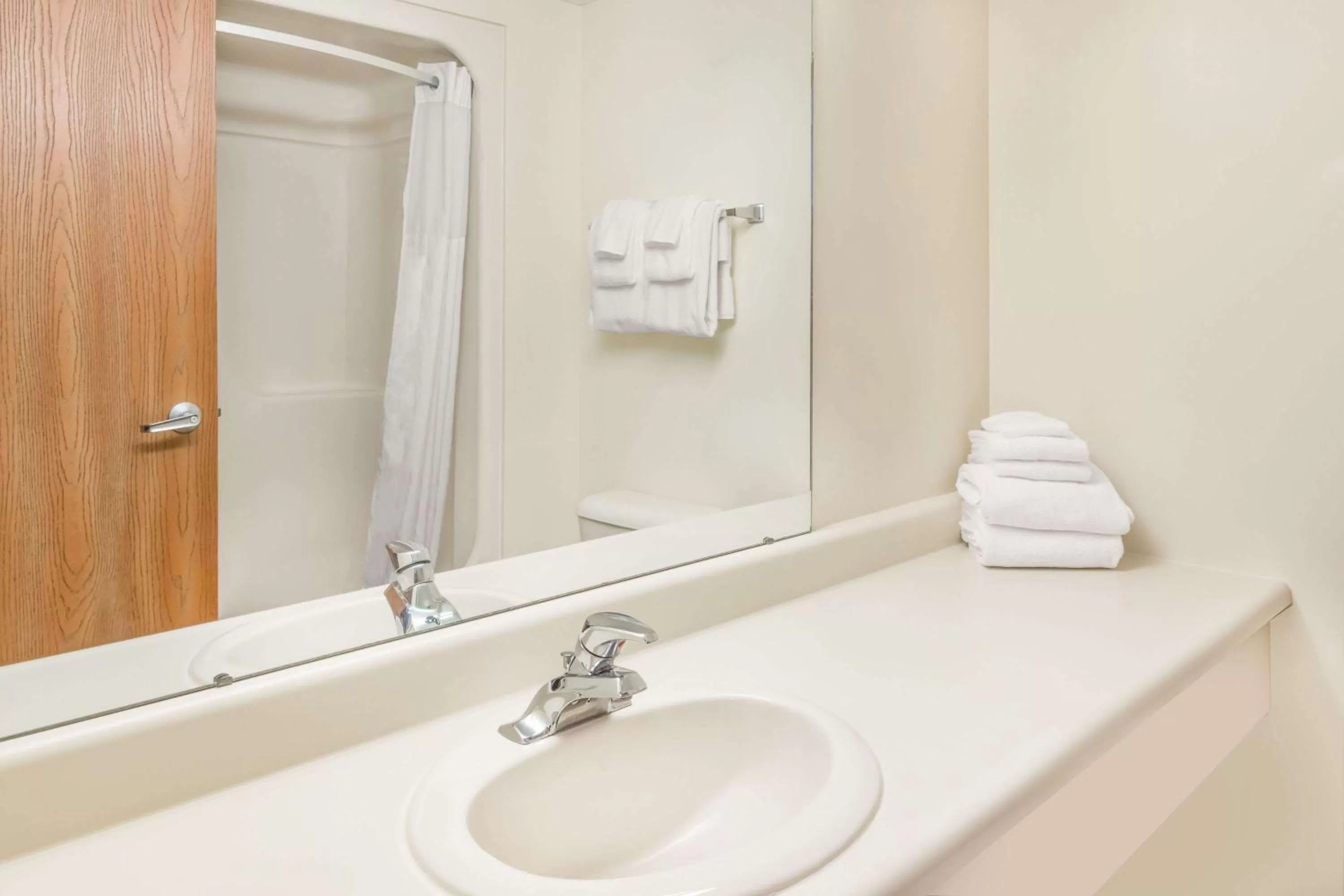 Bathroom in Days Inn by Wyndham Alpena