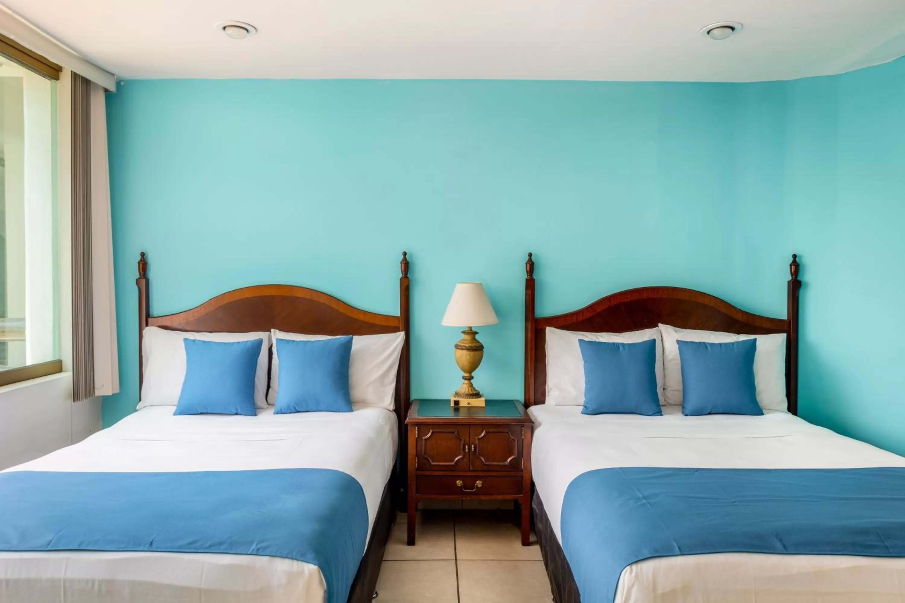 Bed in Hotel Pueblito Vallarta