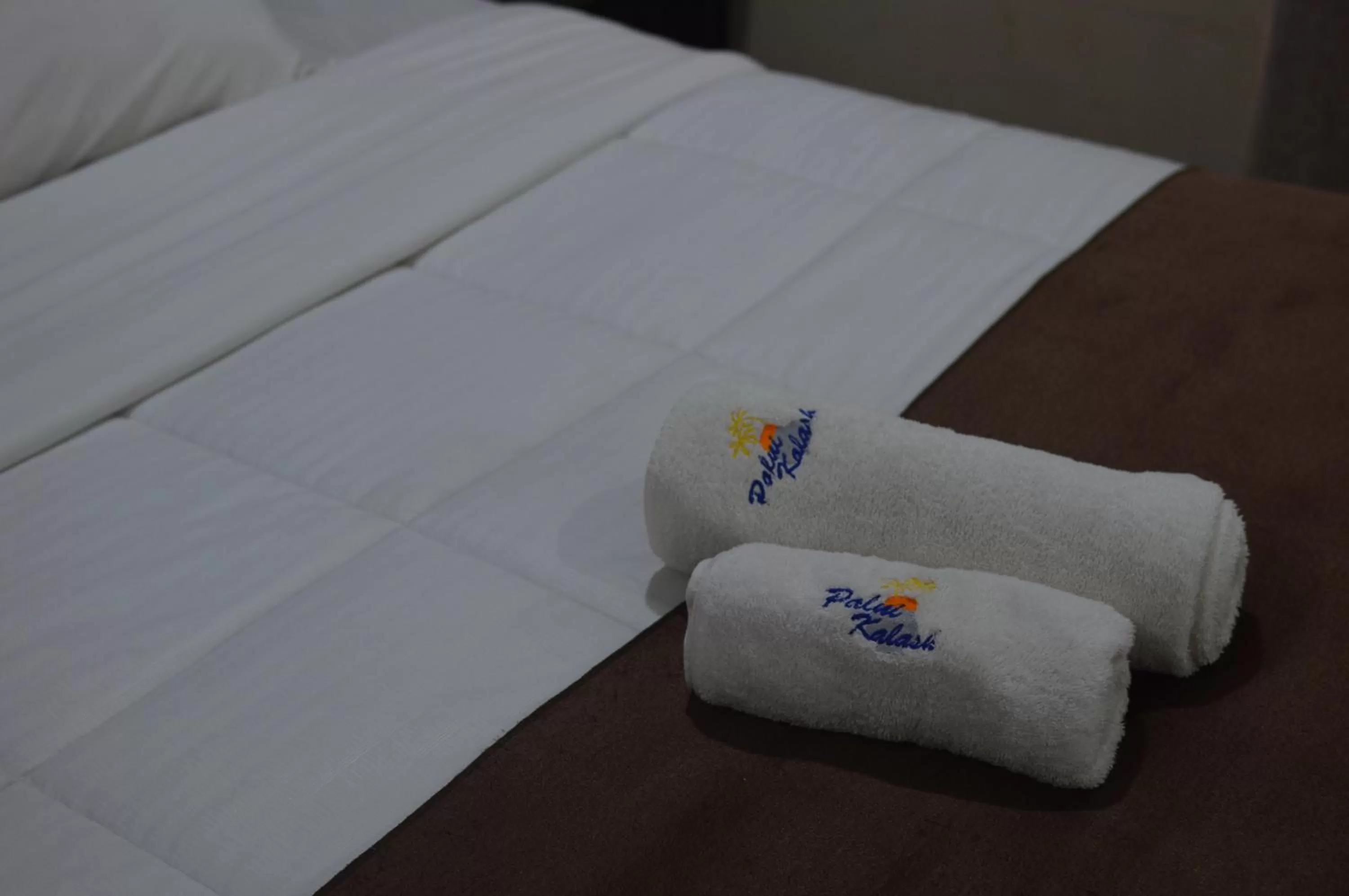 Bed in Palm Kalash Hotel