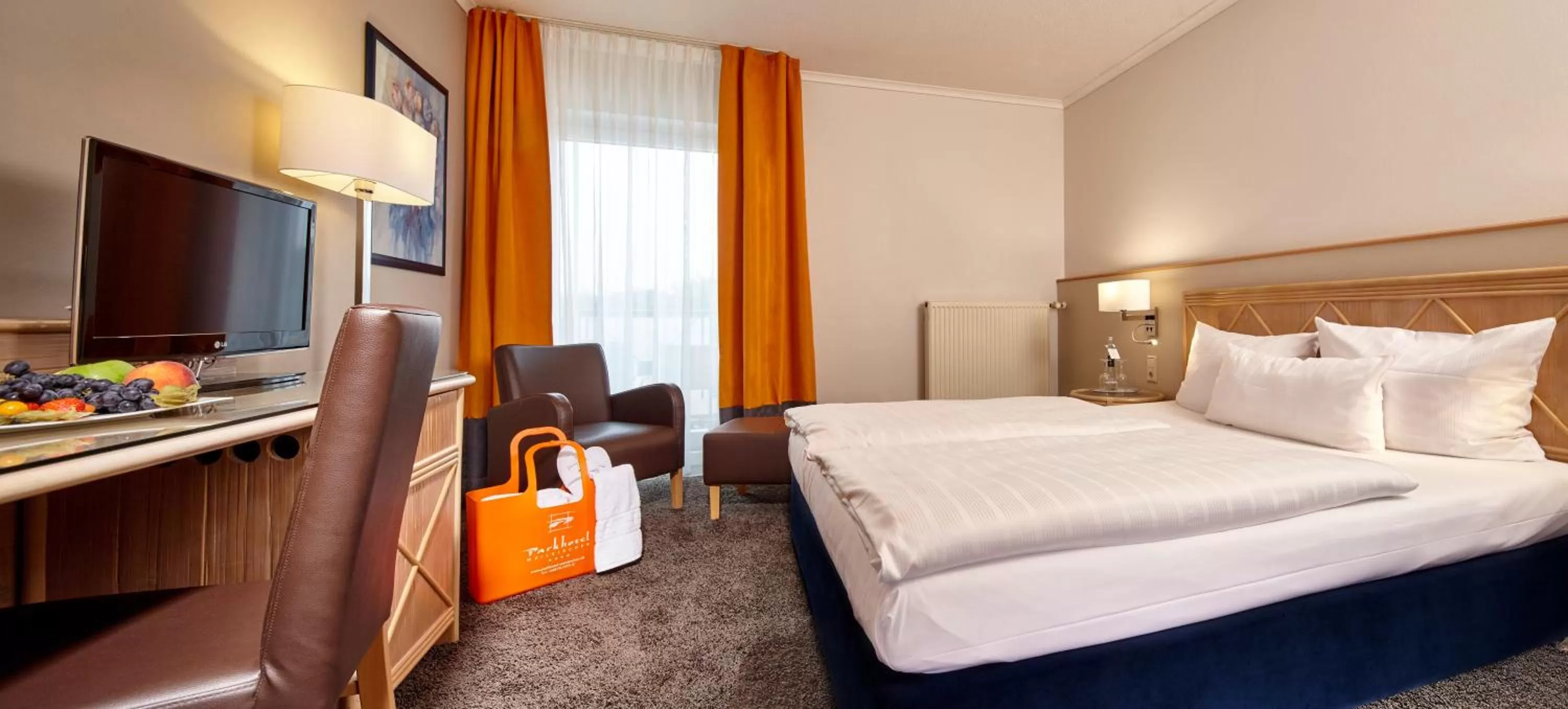 Photo of the whole room, Bed in Parkhotel Weiskirchen