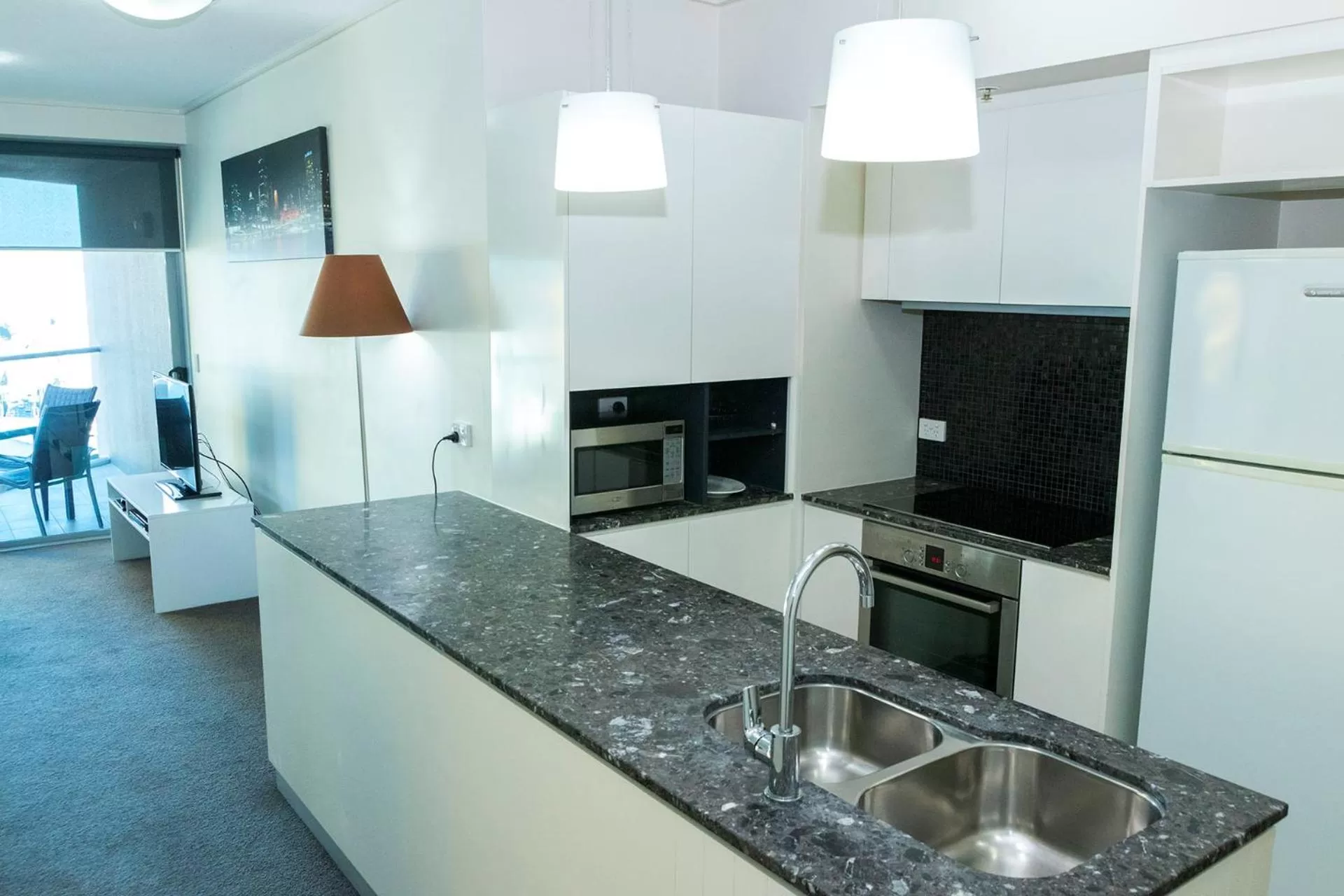 Kitchen or kitchenette in Evolution Apartments