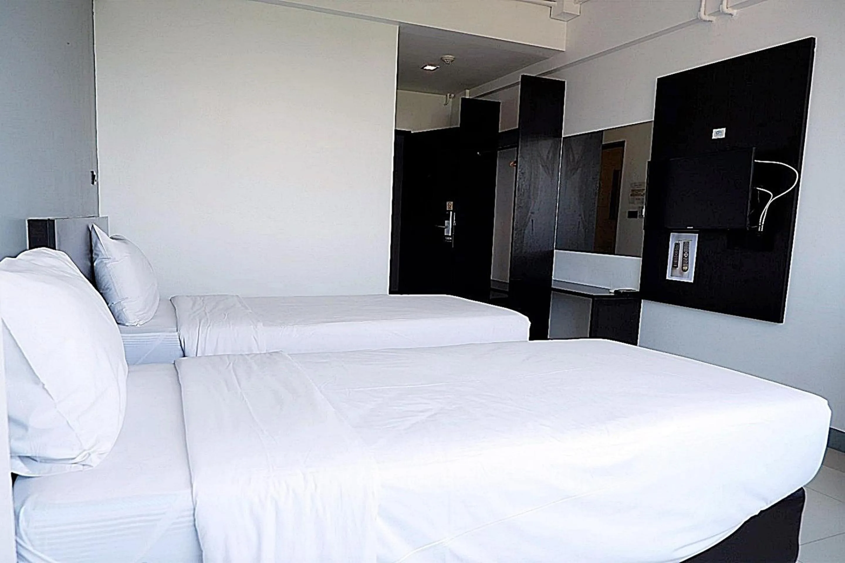 Bed in Izen Budget Hotel & Residence