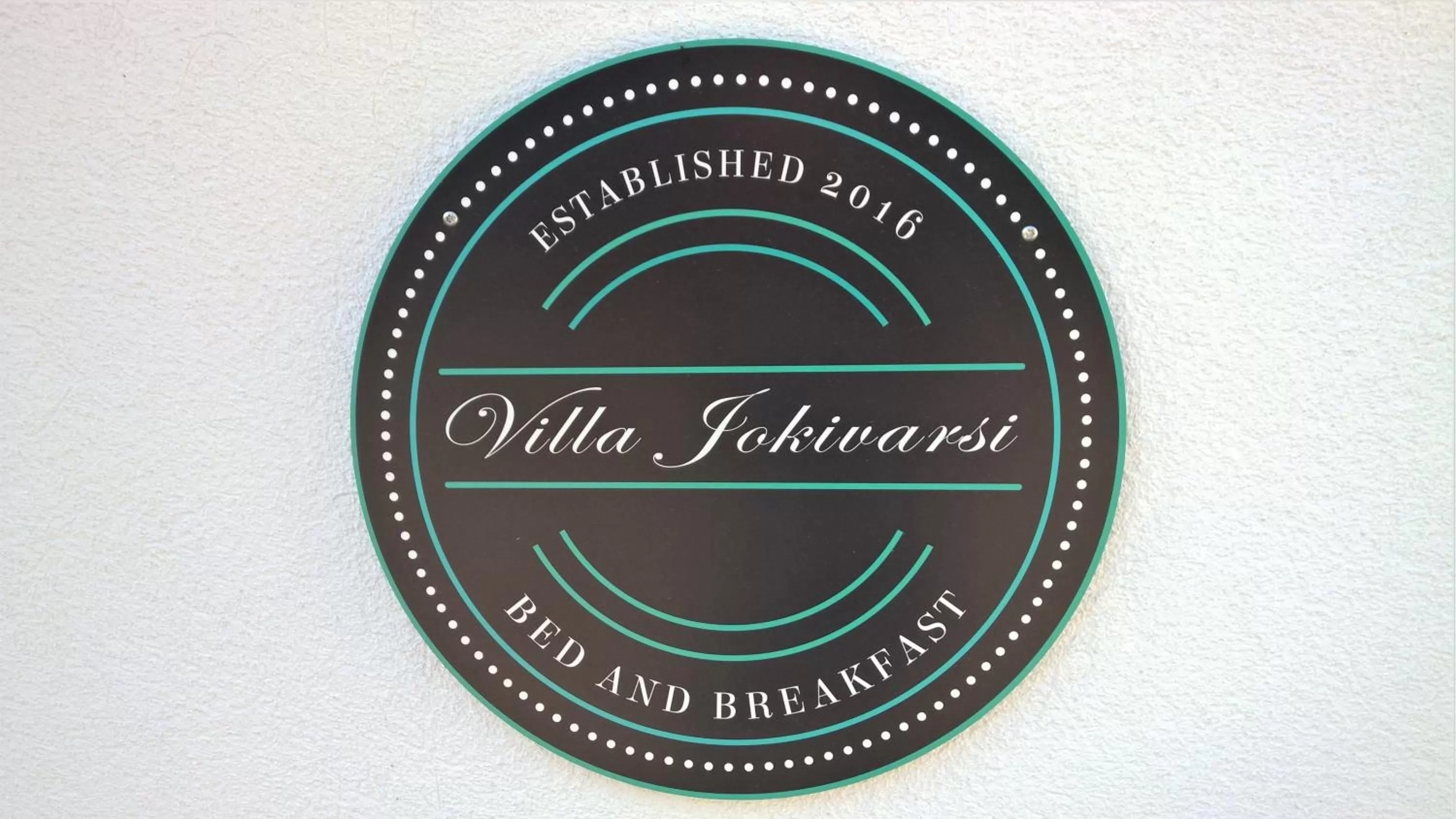 Property logo or sign in Villa Jokivarsi Bed & Breakfast