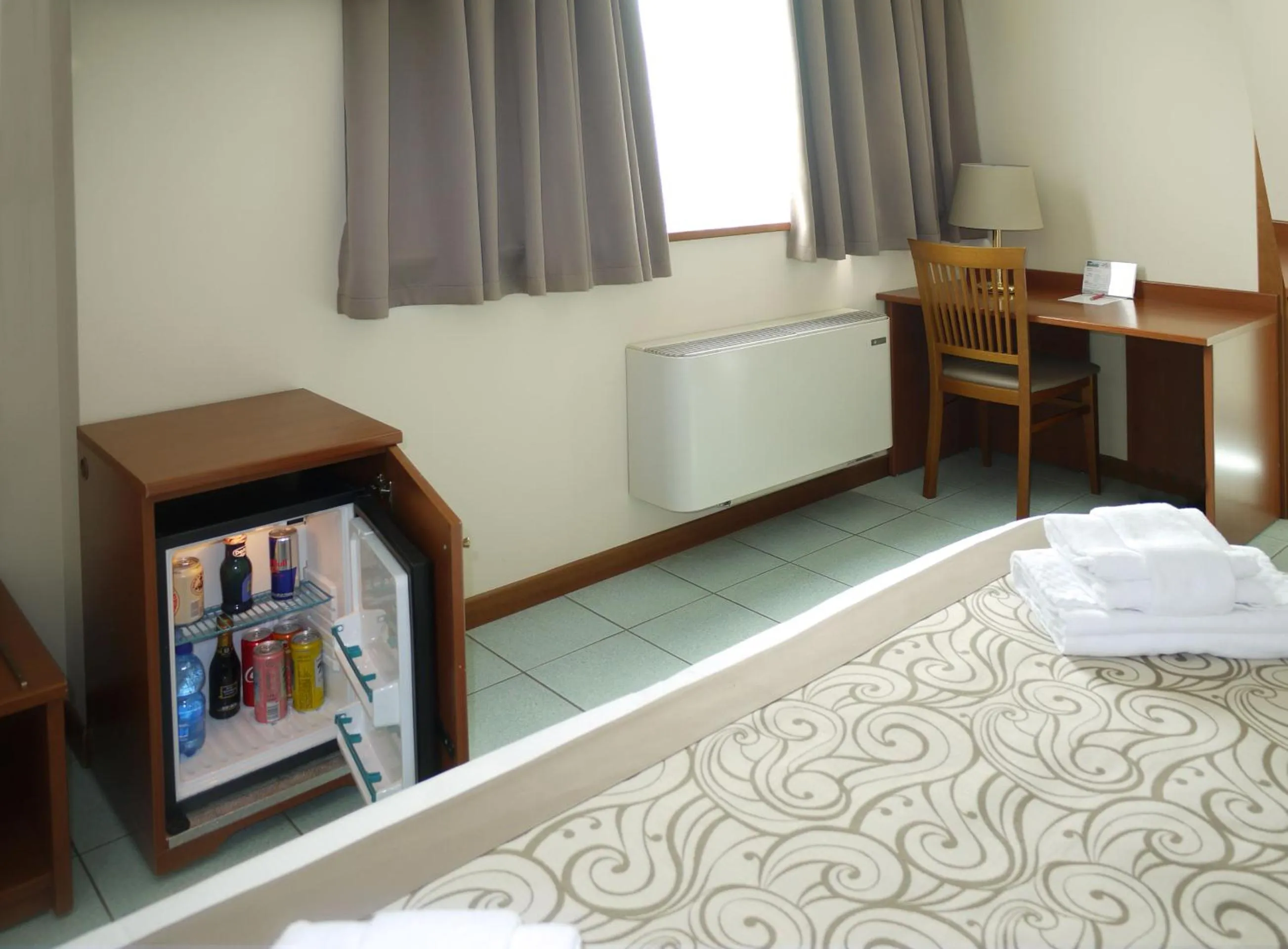 Seating area, Bed in ALA Hotel