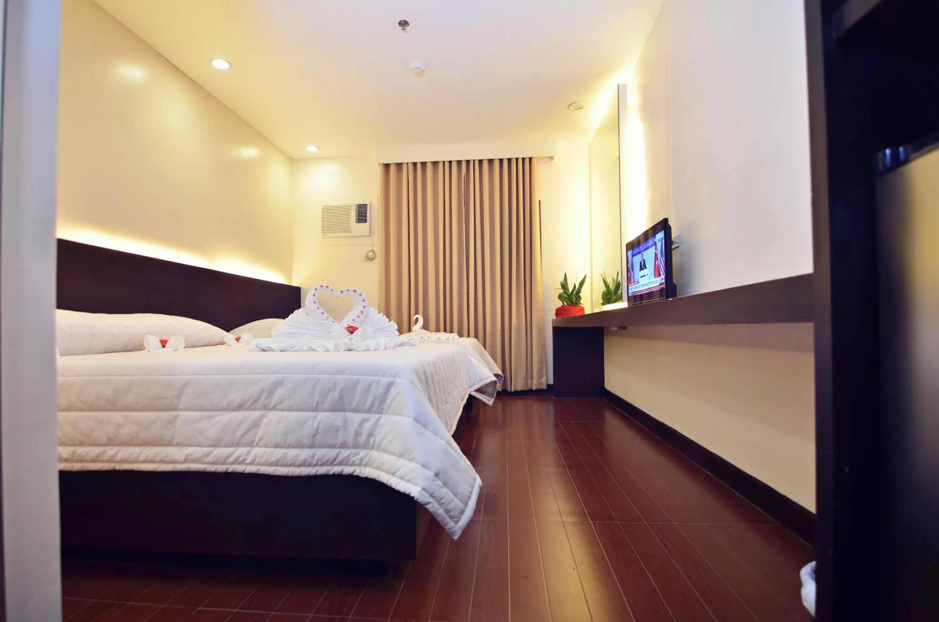 Bed in Citystate Asturias Hotel Palawan