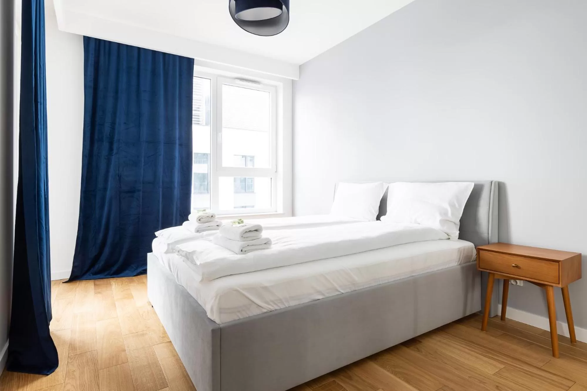 Bed in Symphony Modern Tower Apartamenty