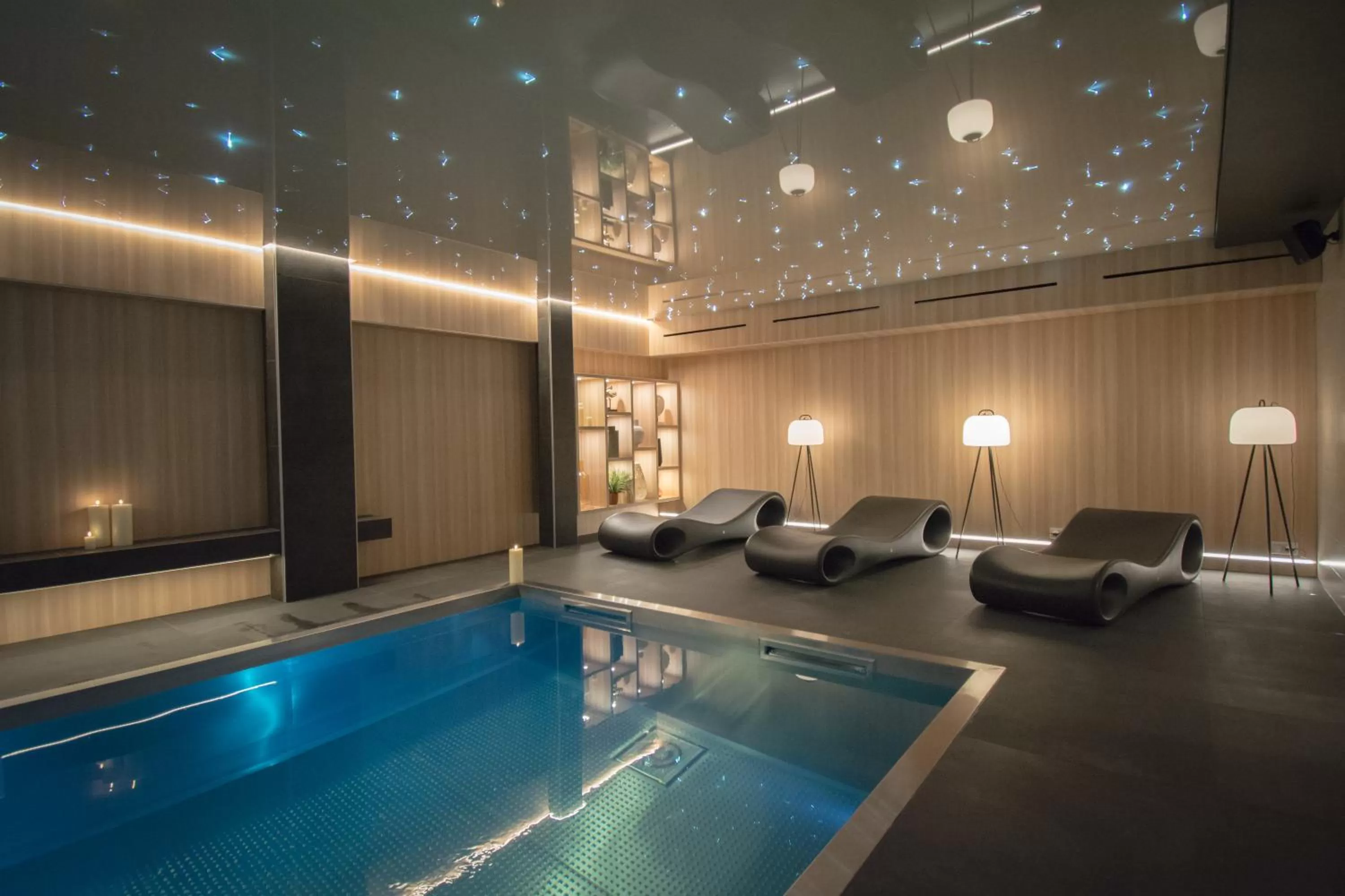 Swimming pool in L' Hôtel & Spa Ribeauville- Haut-Koenigsbourg