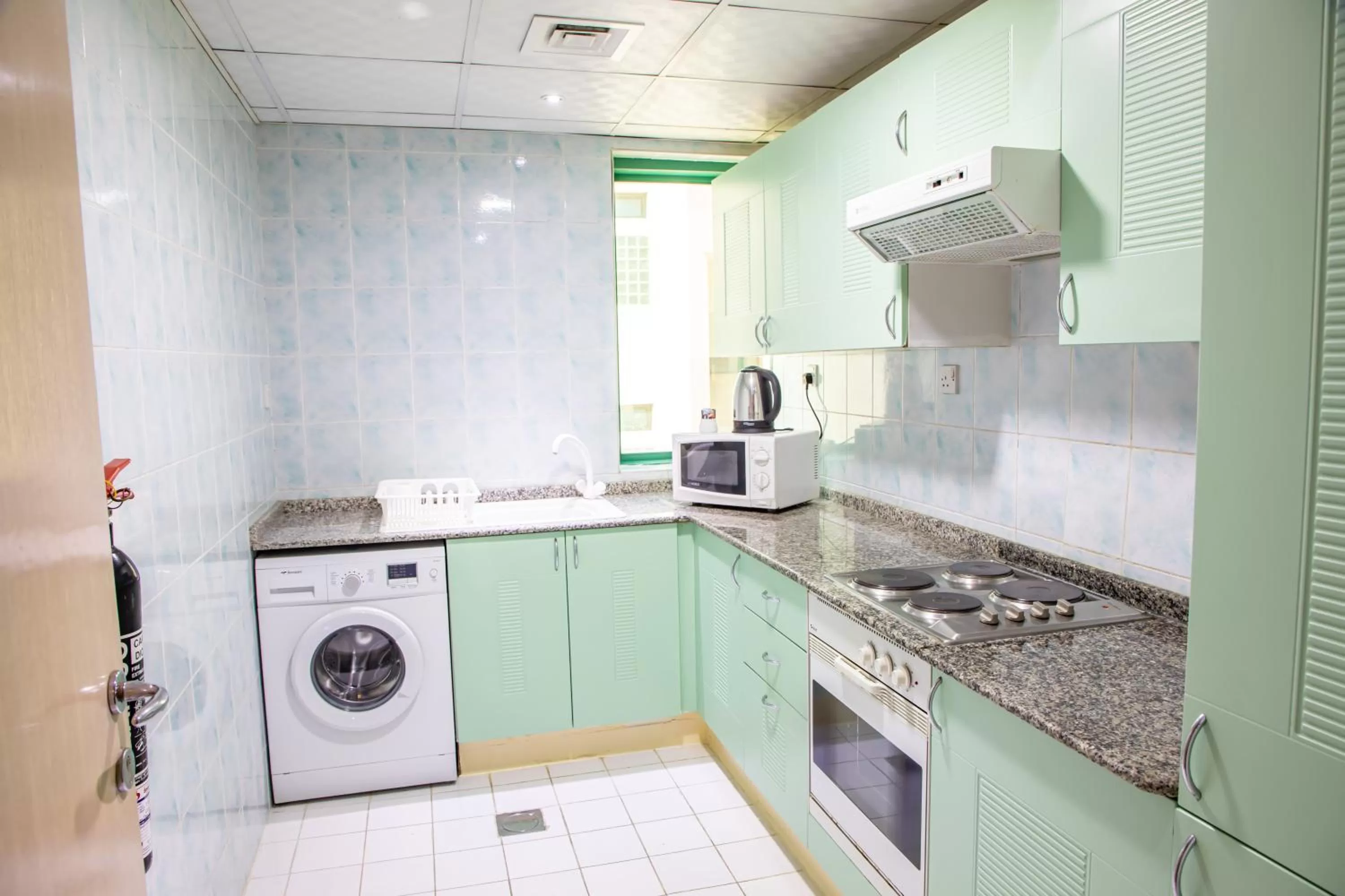 kitchen in West Zone Pearl Hotel Apartment