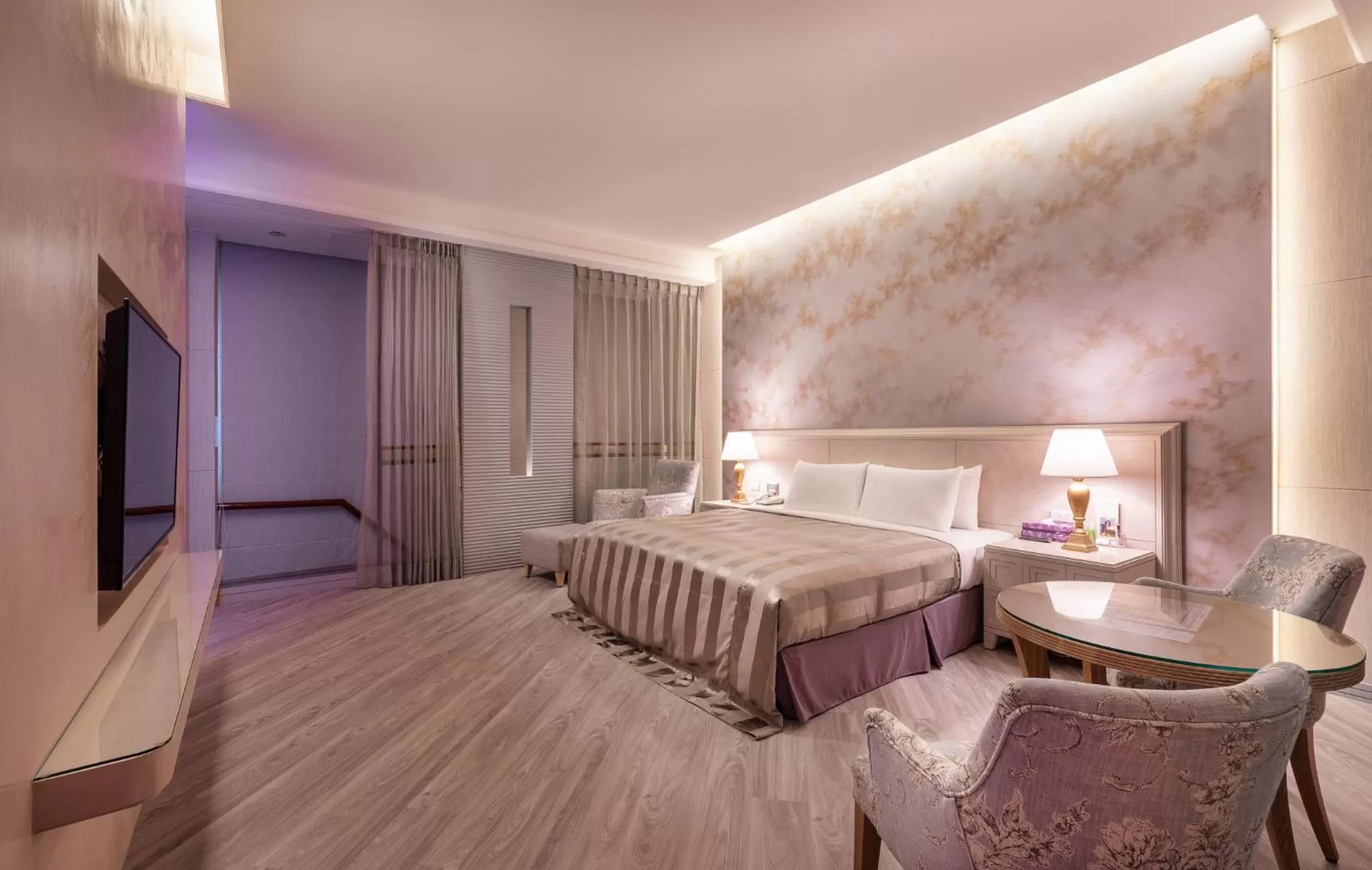 Bed in Purple Garden Motel