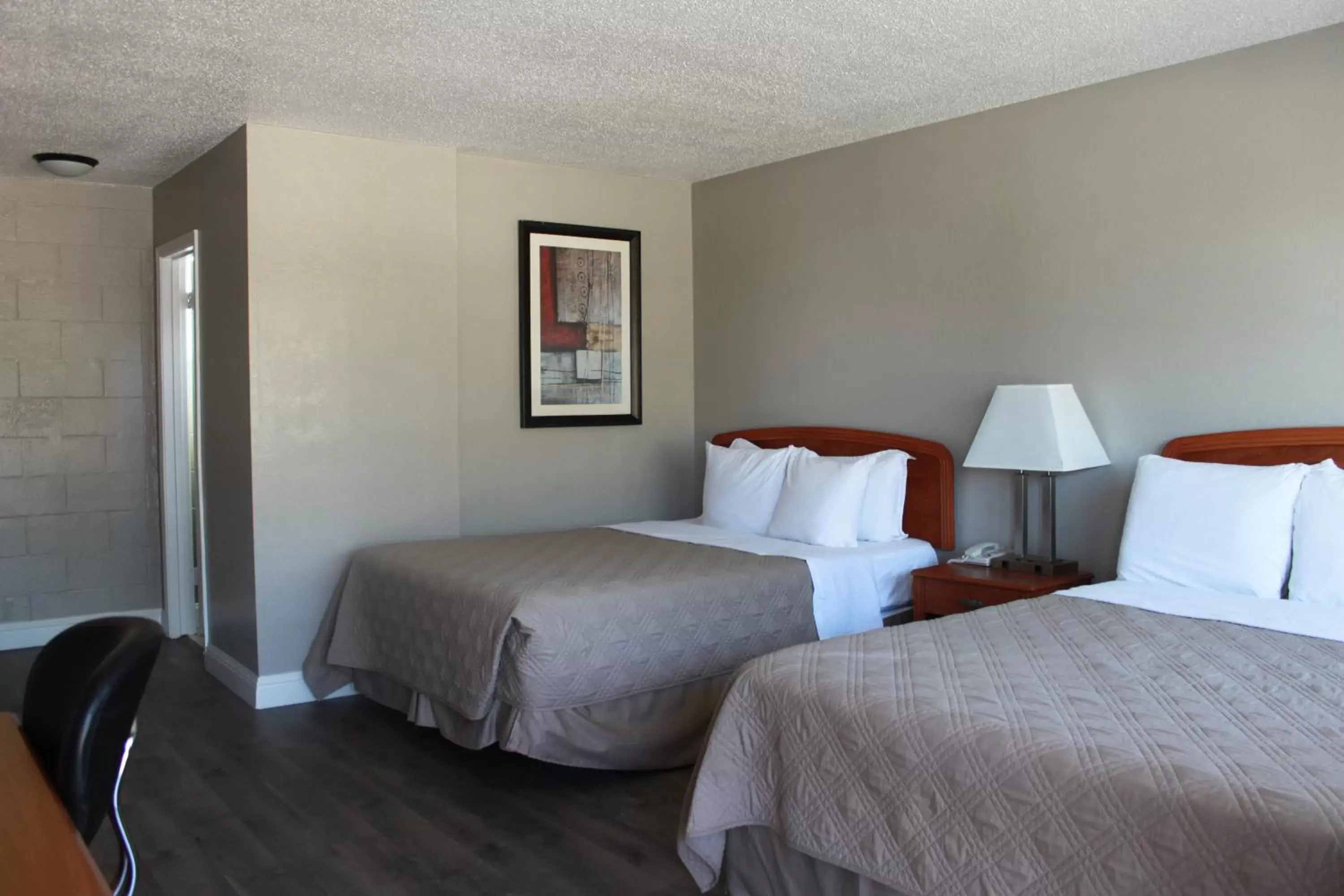 Queen Room with Two Queen Beds in Budget Inn Queen Room with Two Queen Beds in Budget Inn