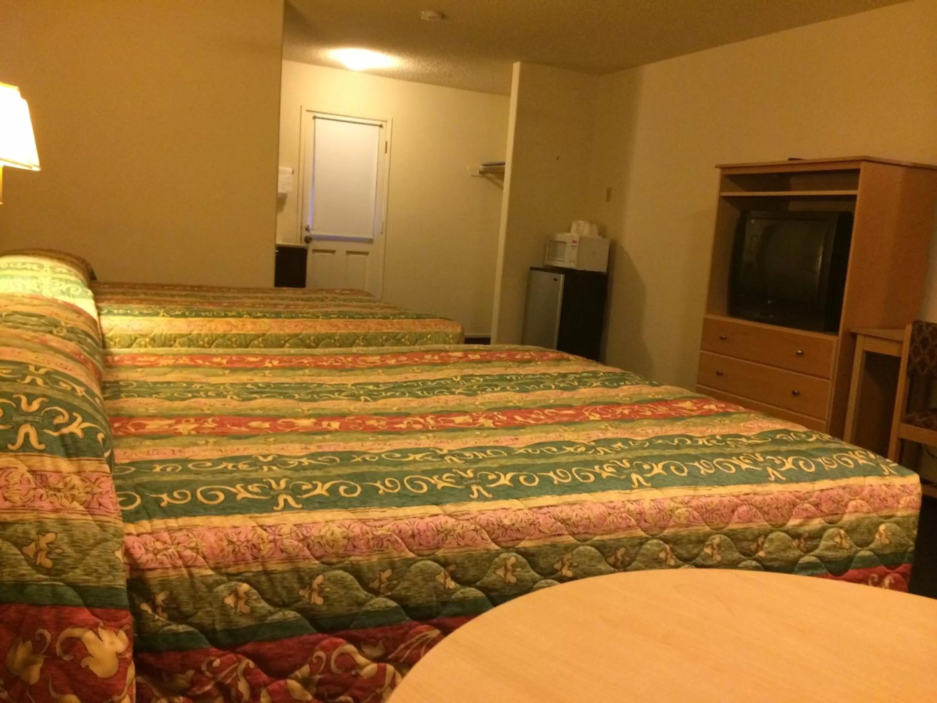 Bed in Value Inn & Suites
