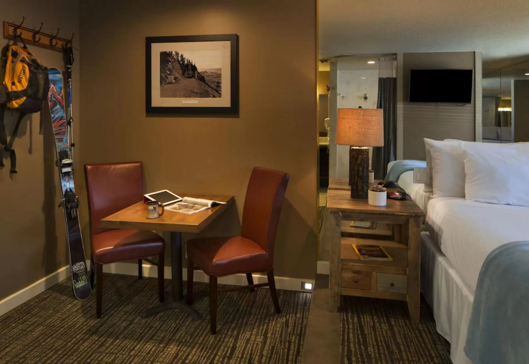 Seating area, Bed in Postmarc Hotel and Spa Suites