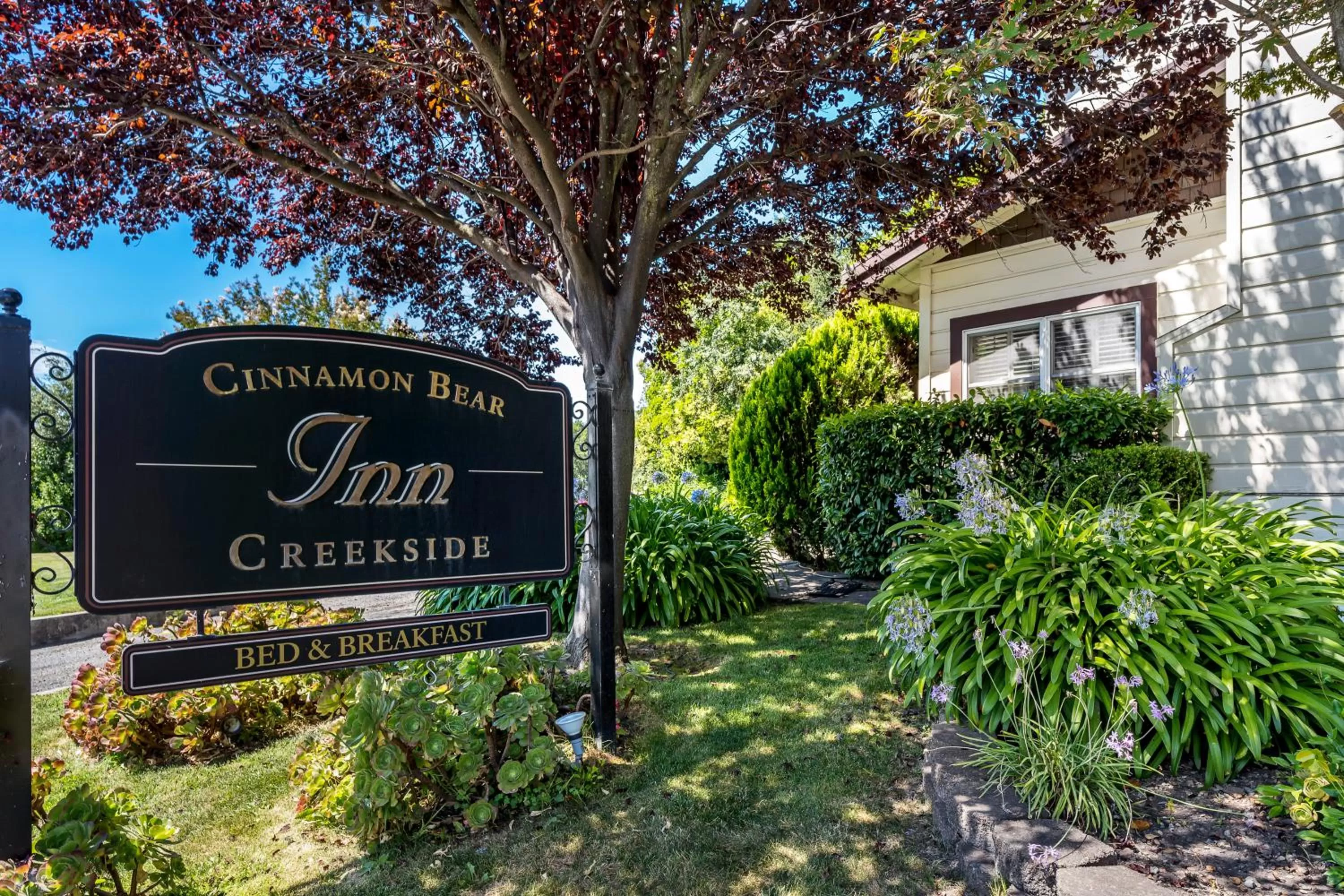 Property logo or sign in Cinnamon Bear Creekside Inn