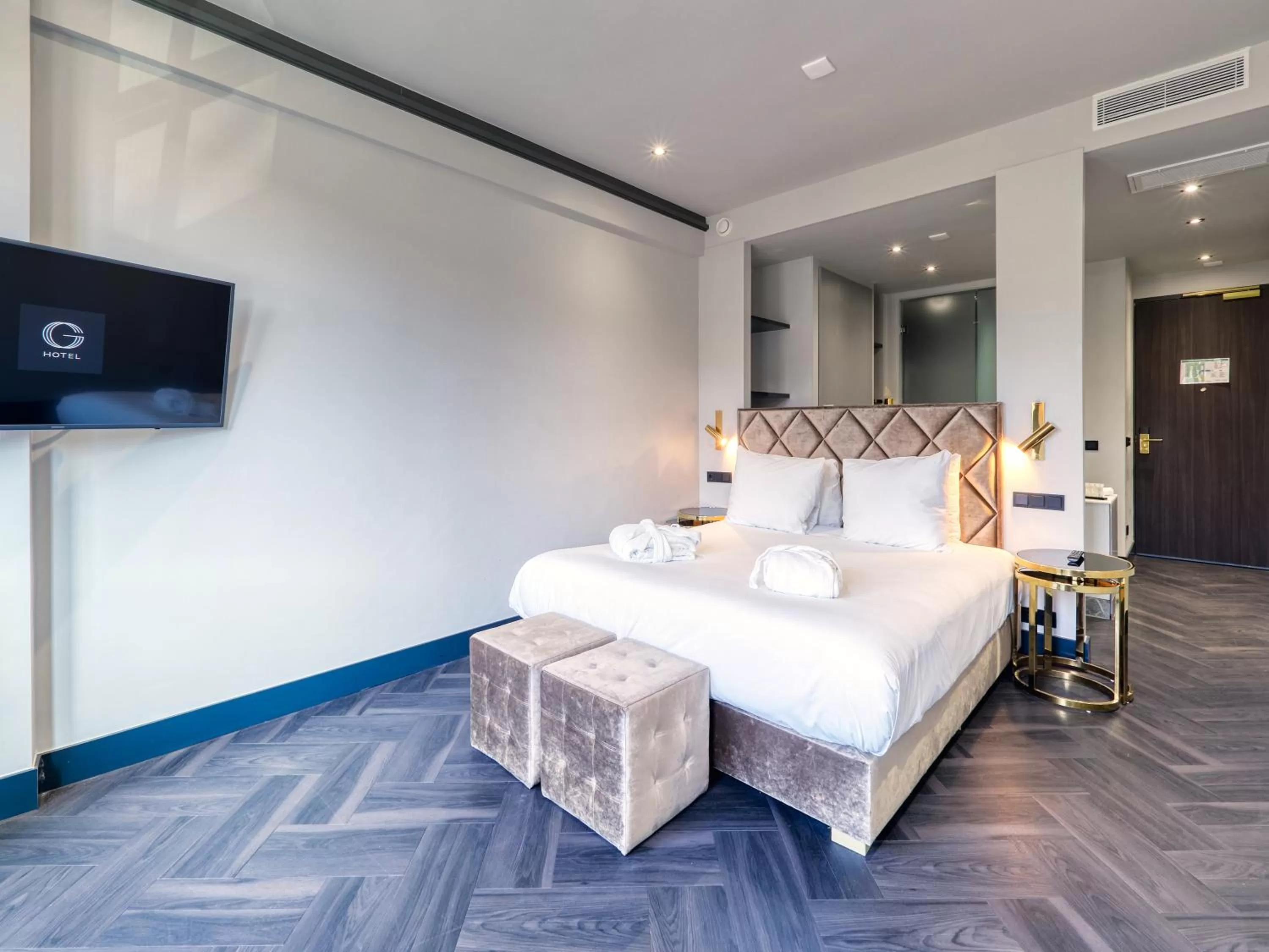 Bed in Triple G Hotels