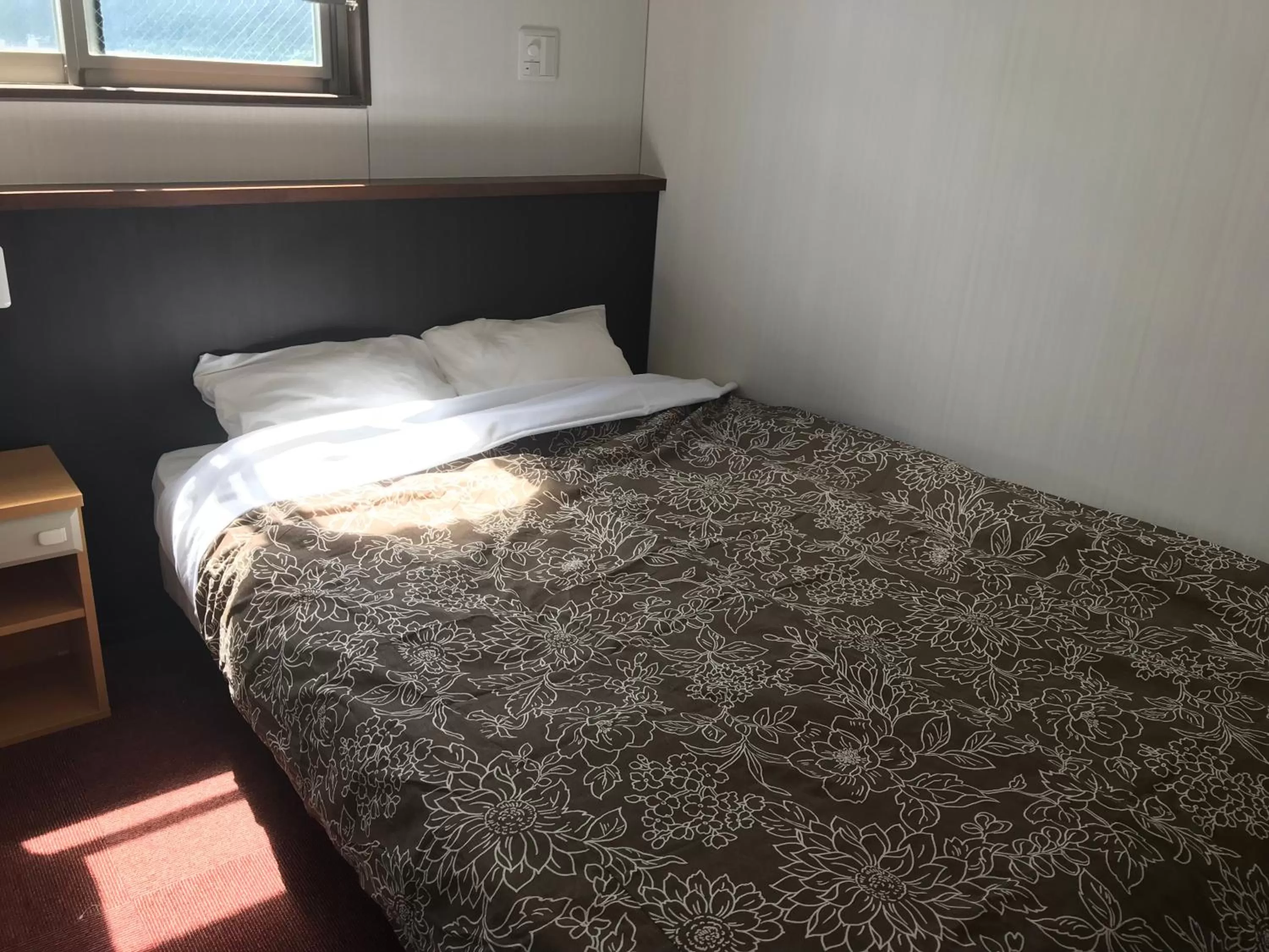 Bed in Hotel Famitic Nikko Station