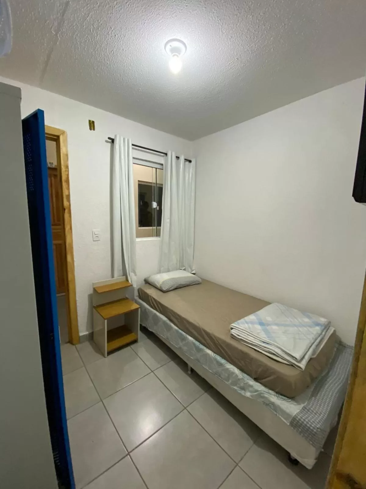 Bed in Nova Pousada Consulado