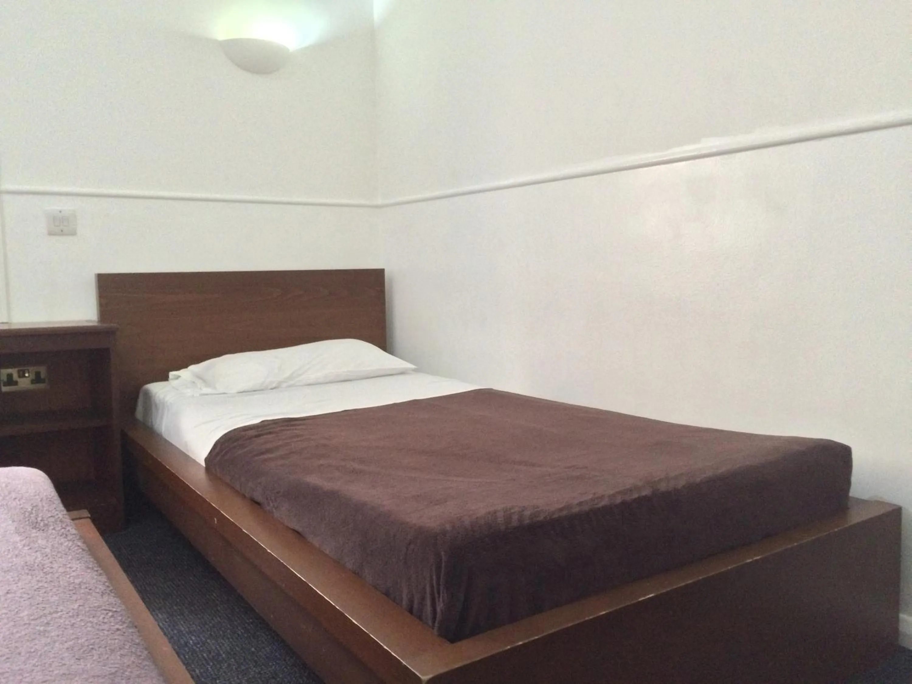 Bed in London Continental Hotel