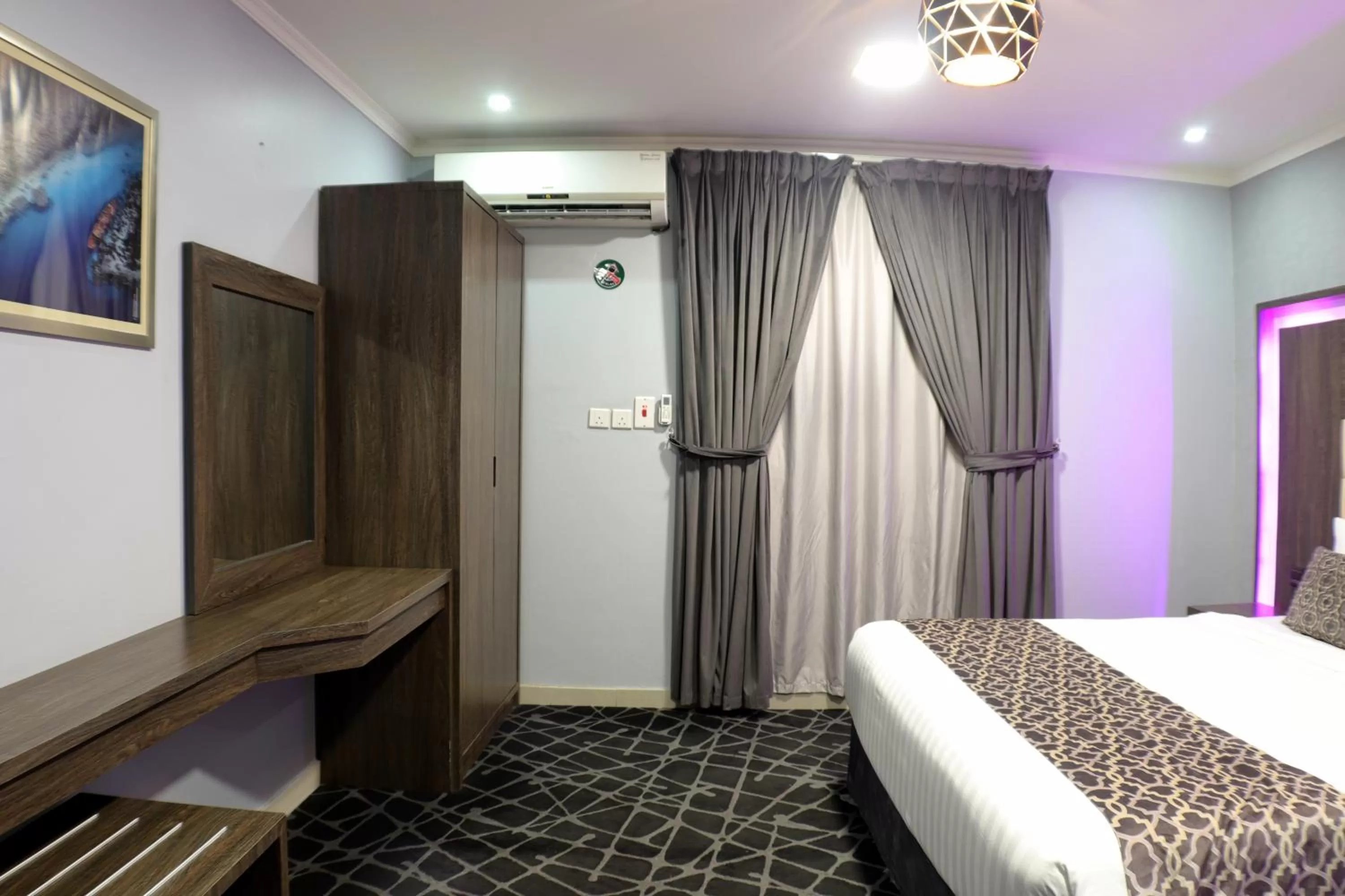 Bed in Maskan Al Dyafah Hotel Apartments