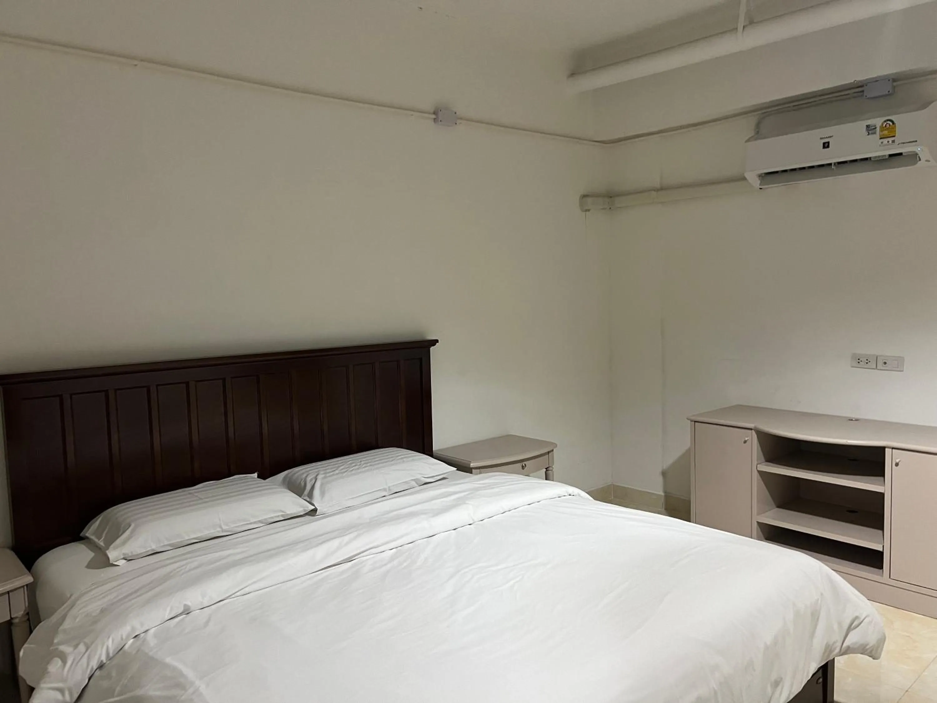 Bed in Mall Suites Hotel