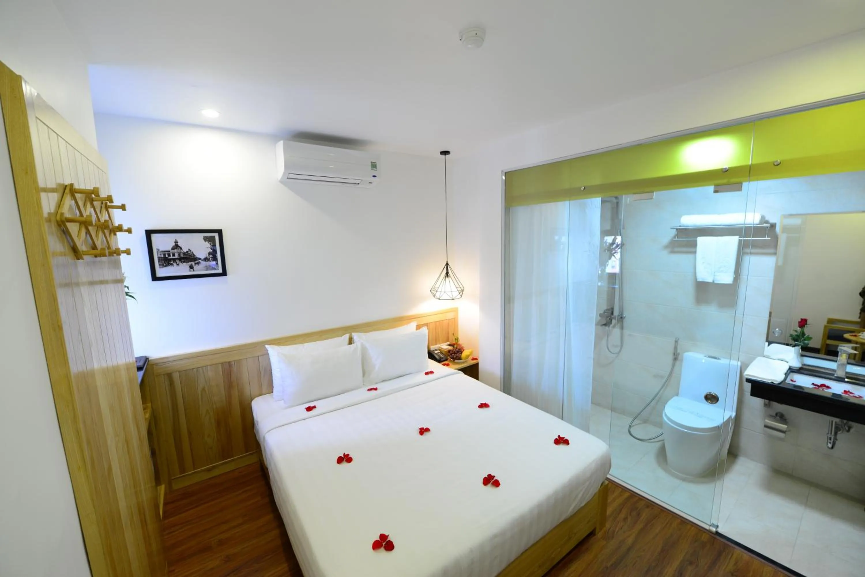 Bed in Blue Hanoi Inn Luxury Hotel