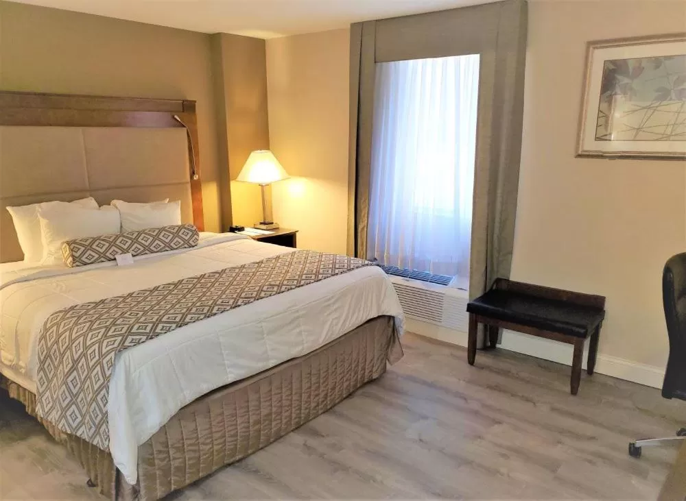 Bed in Clayton Plaza Hotel & Extended Stay