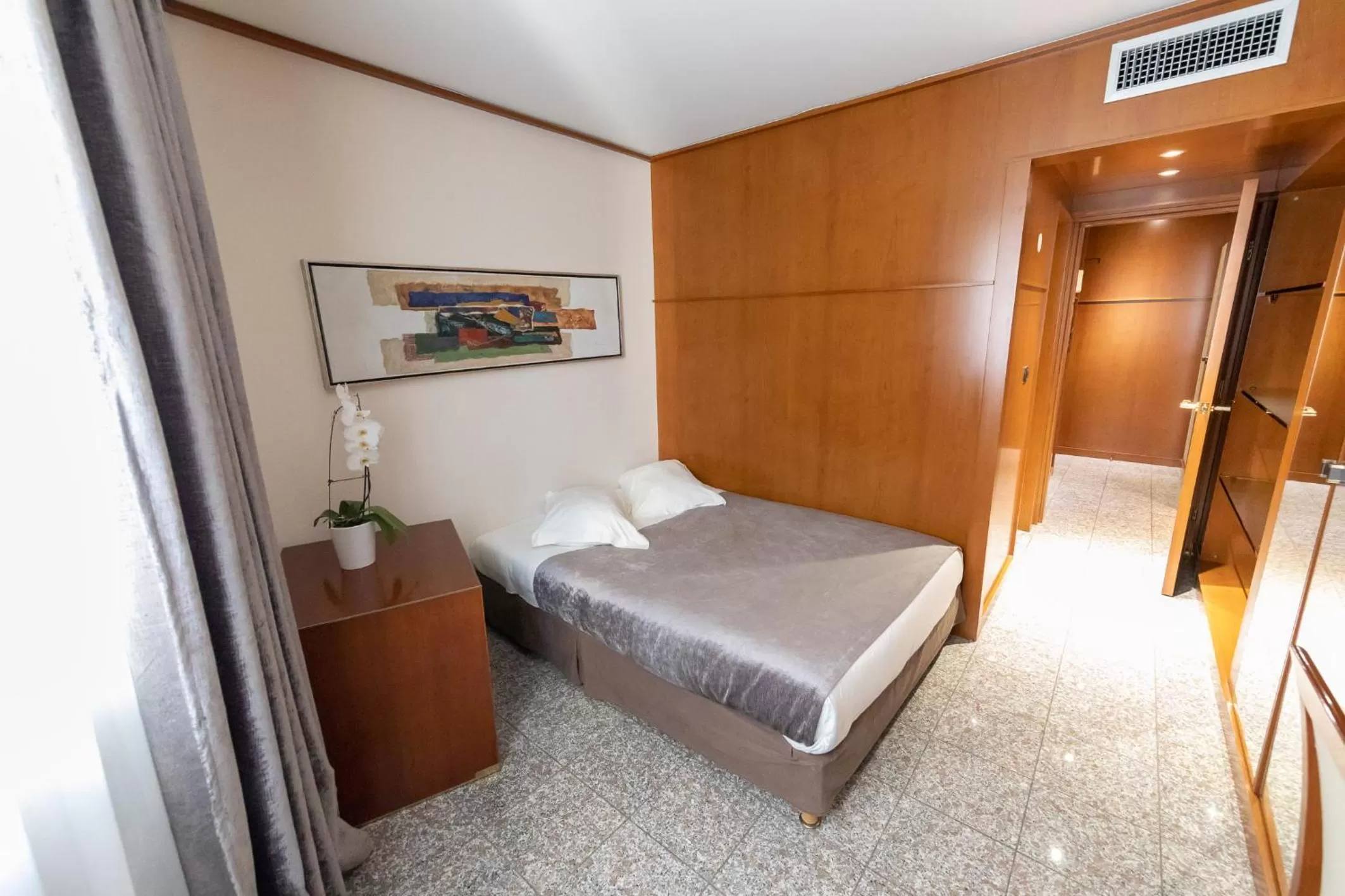 Bed in Goldstar Apartments & Suites