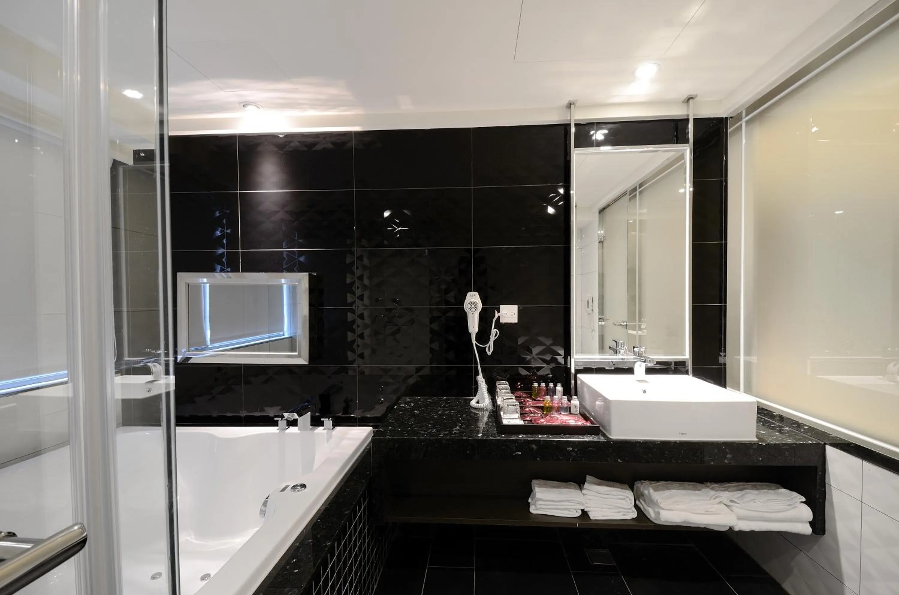 Bathroom in V-one Vogue Hotel