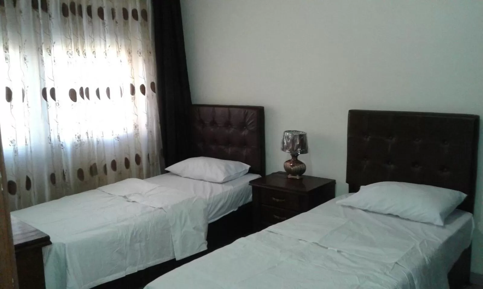 Bed in Al Tawheed Hotel Apartments