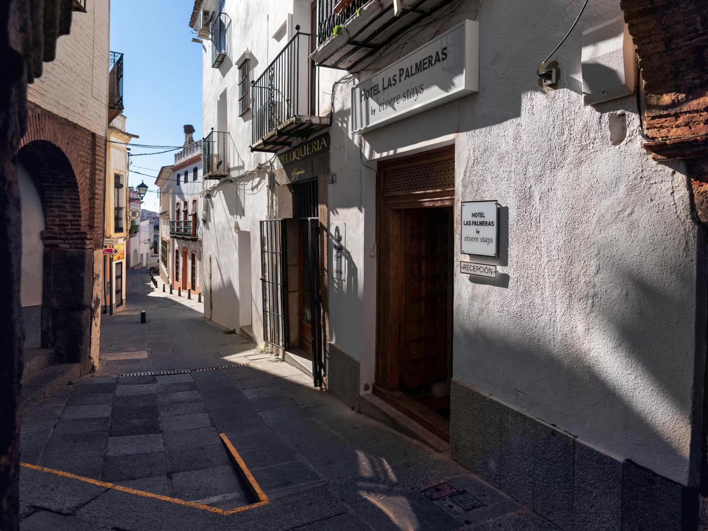 Property building in Hotel Las Palmeras by Vivere Stays