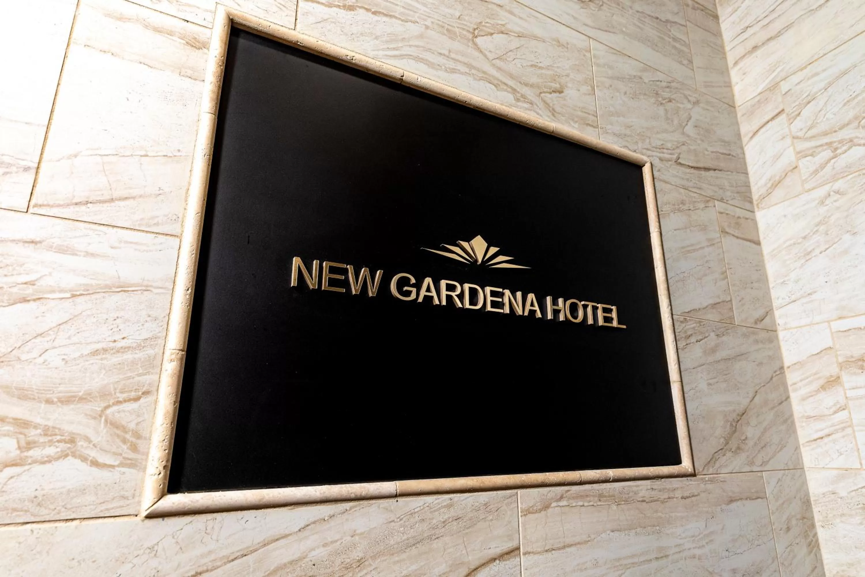 Property logo or sign in New Gardena Hotel