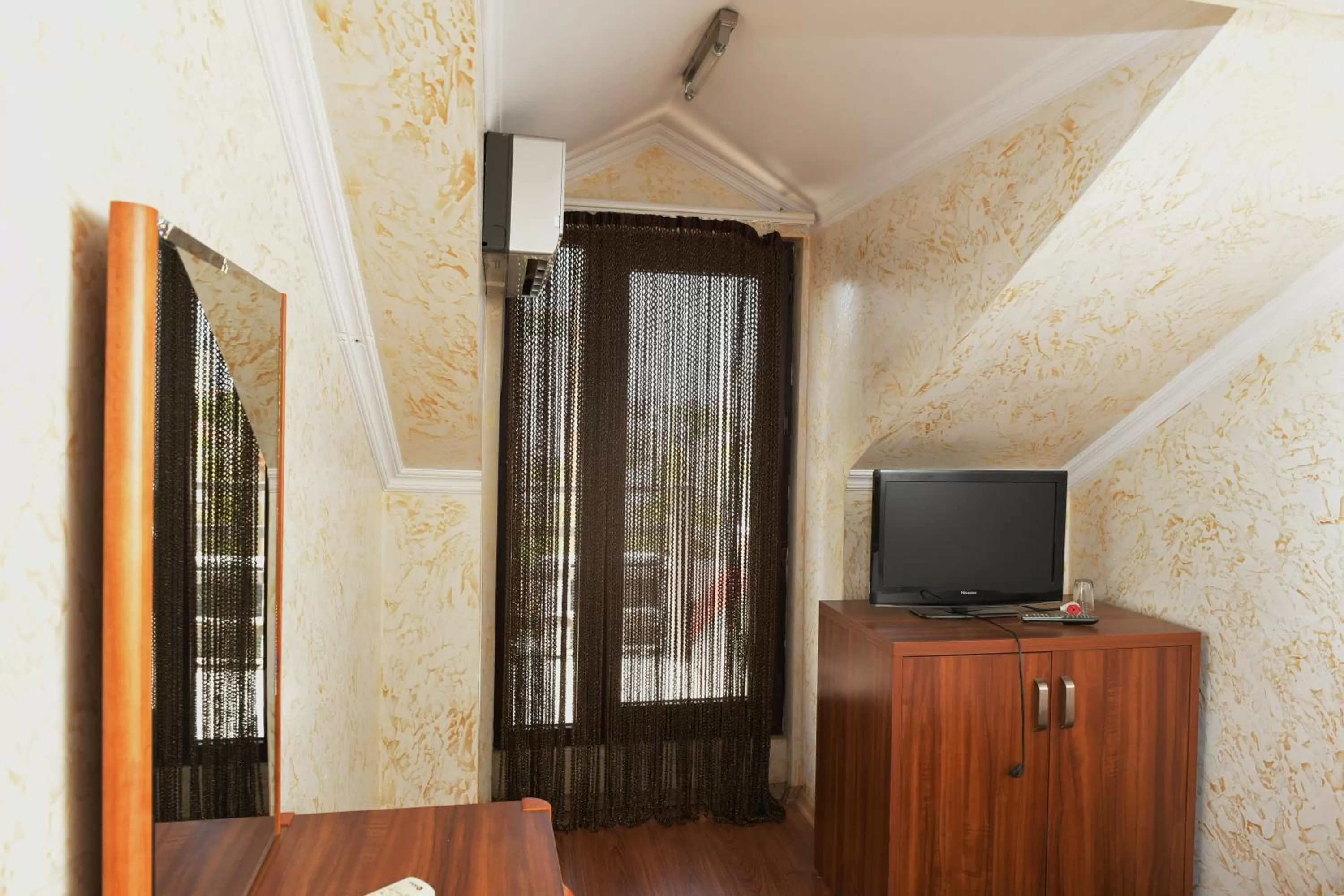 TV/Entertainment Center in Antika Hotel