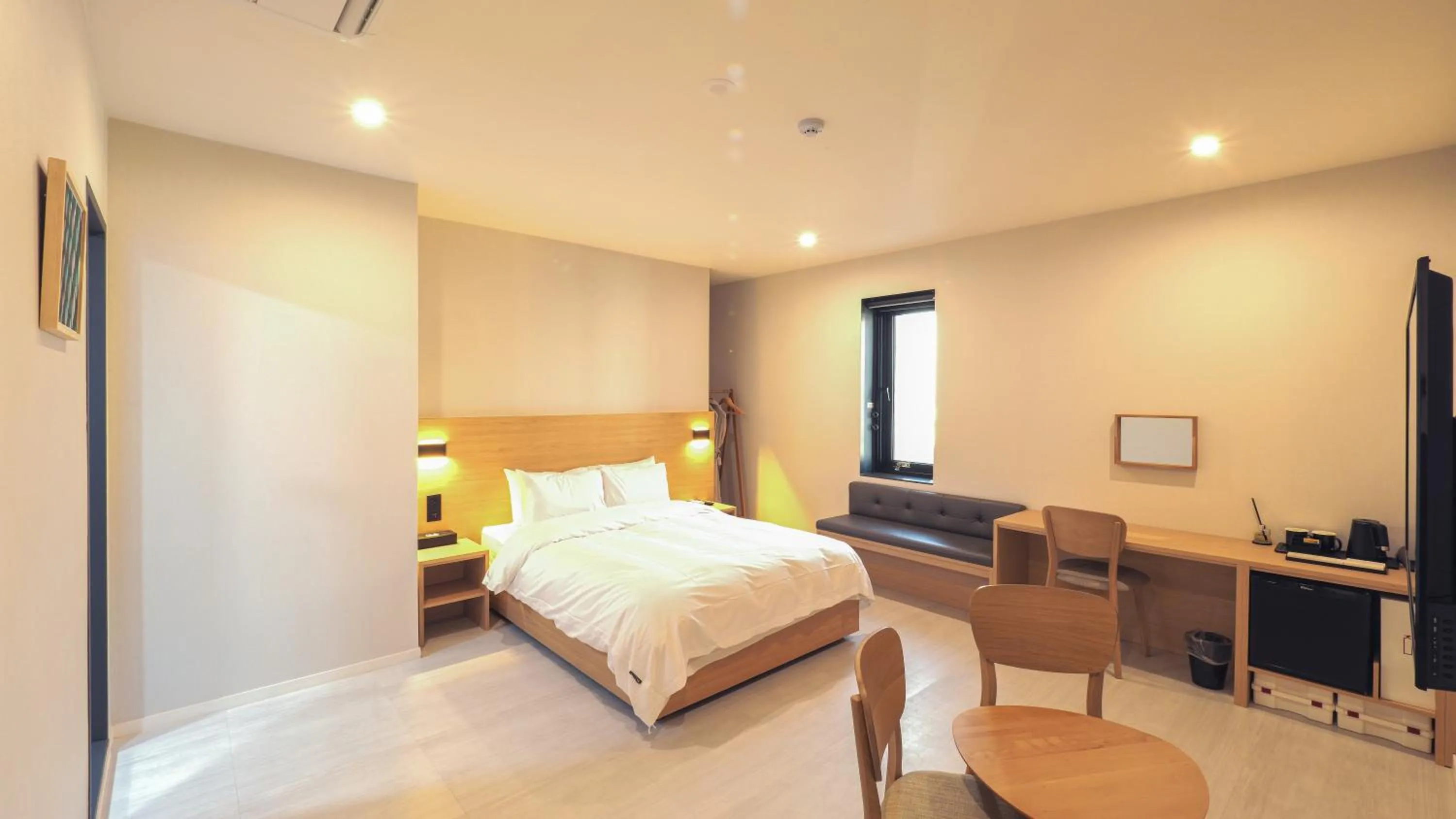 Bed in Mipo Oceanside Hotel