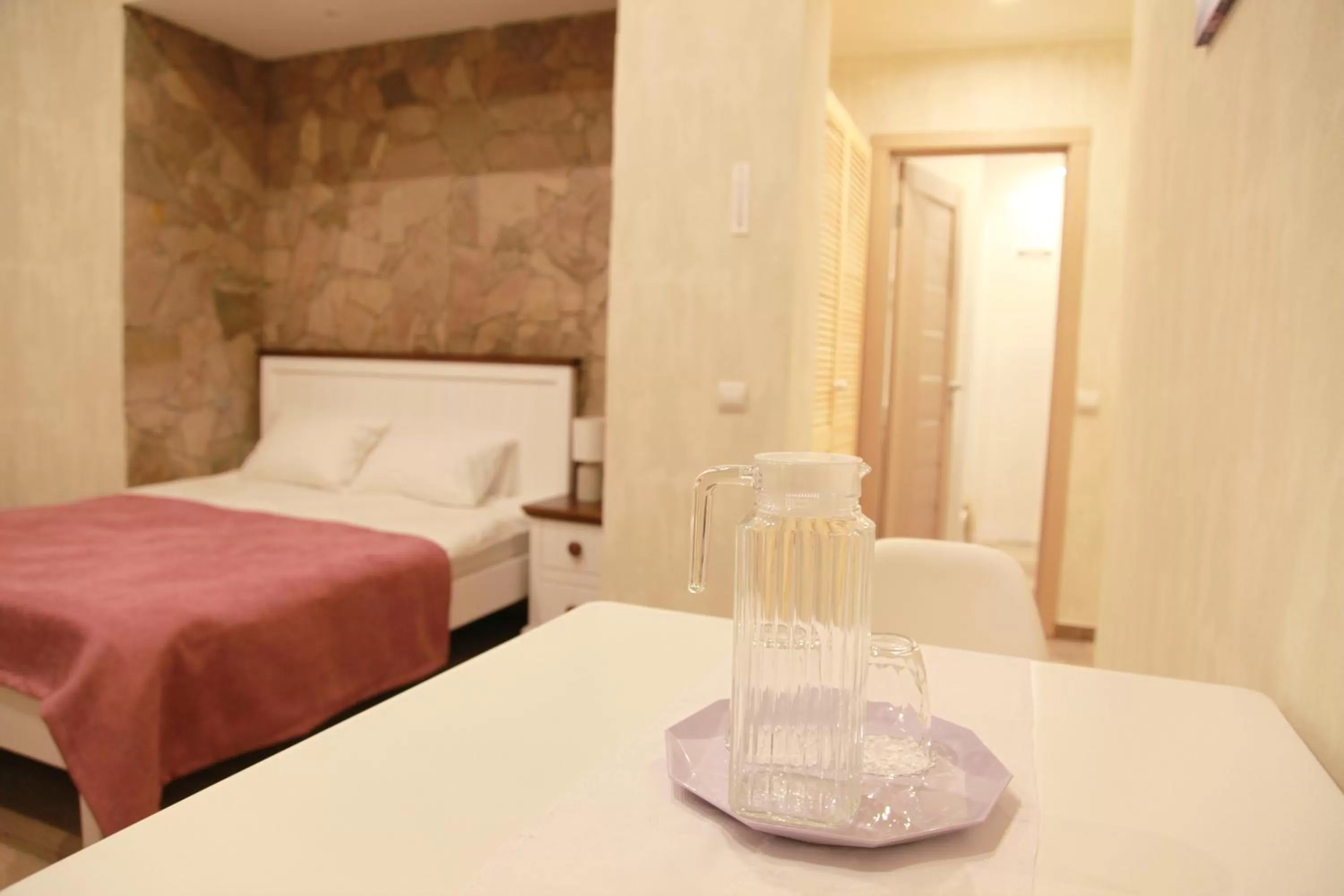 Bed in WINE & ROSE BOUTIQUE HOTEL