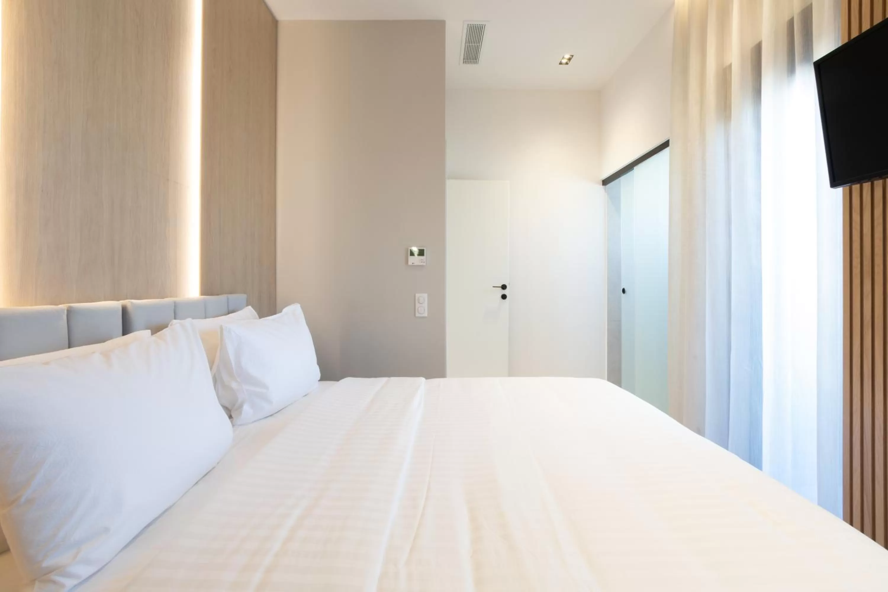 Bed in Incanto Boutique Suites - Neos Kosmos