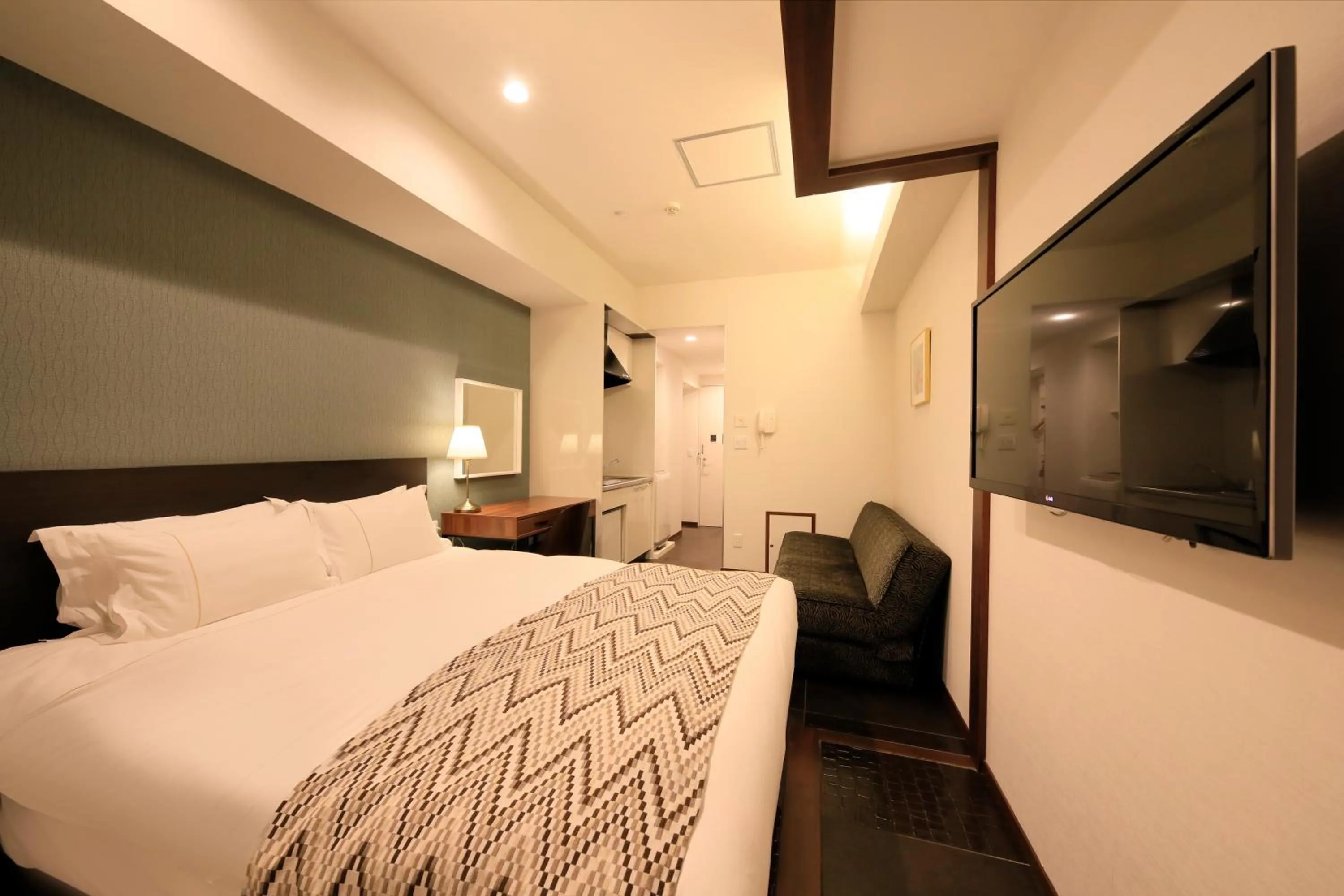 Photo of the whole room, Bed in Centurion Hotel Residential Akasaka Station