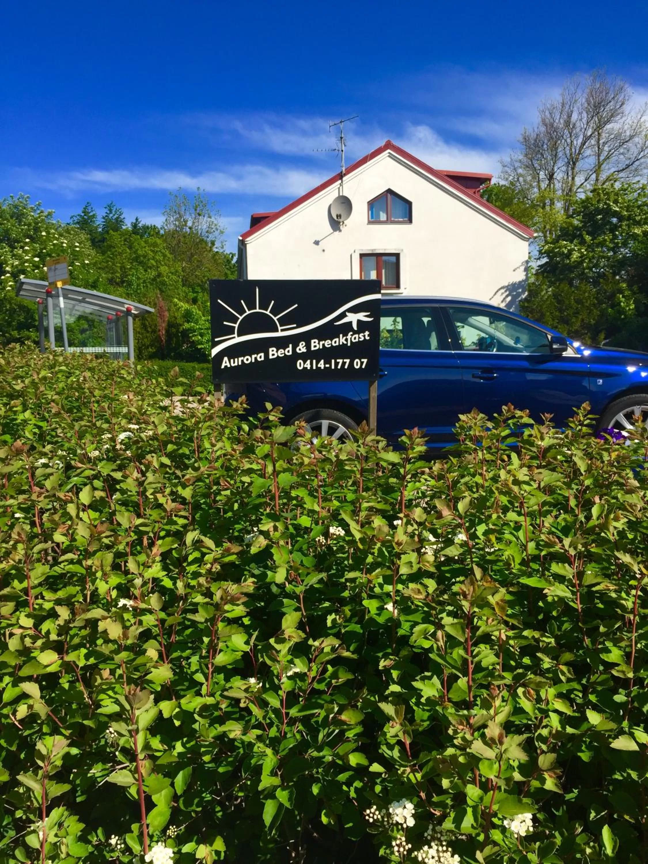 Property logo or sign in Aurora Bed & Breakfast