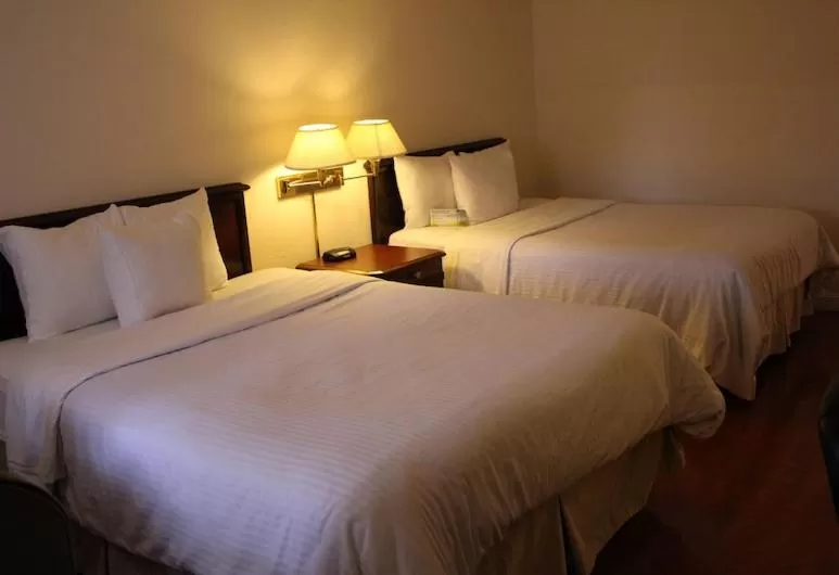 Bed in Days Inn & Suites by Wyndham Sunnyvale