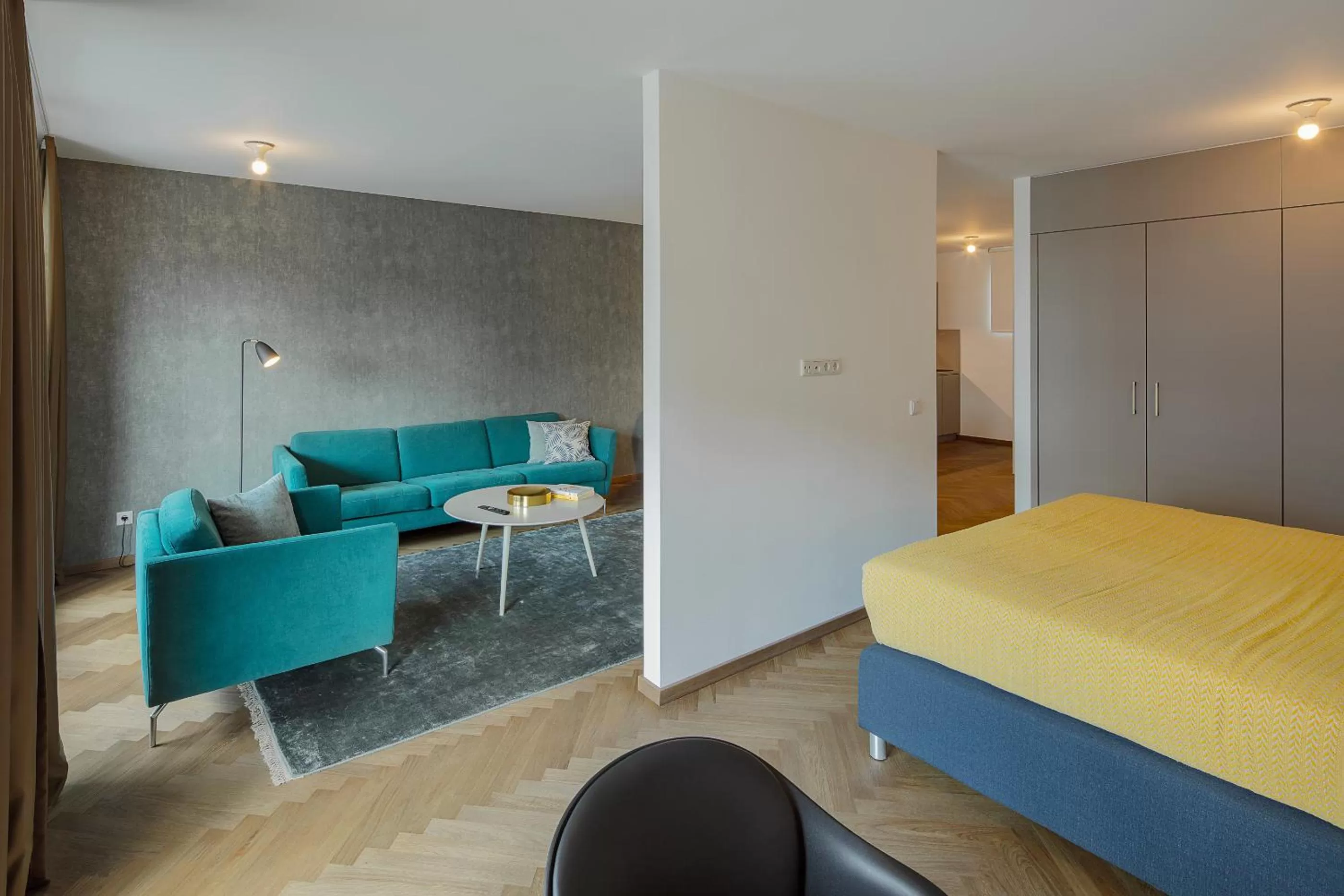 Living room, Bed in DD Suites Serviced Apartments