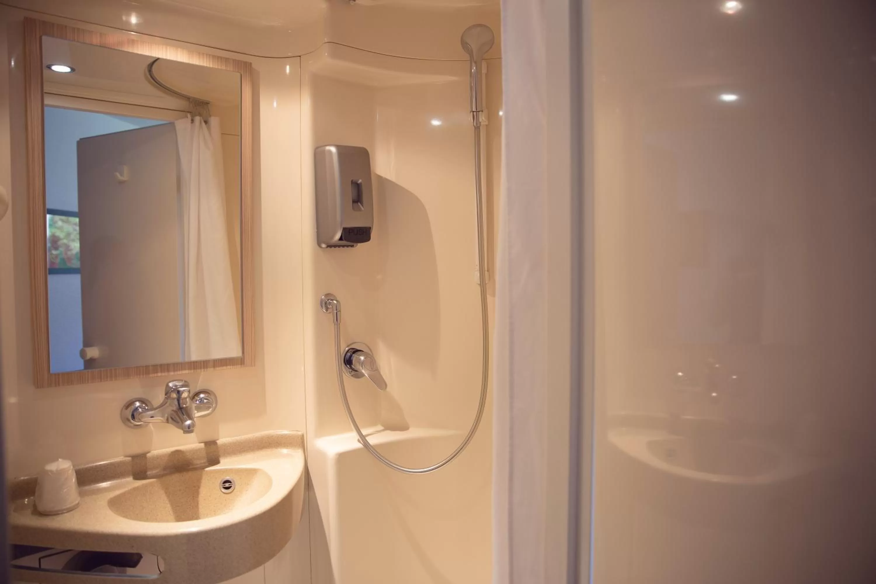 Shower in Premiere Classe Roissy Aéroport Charles De Gaulle