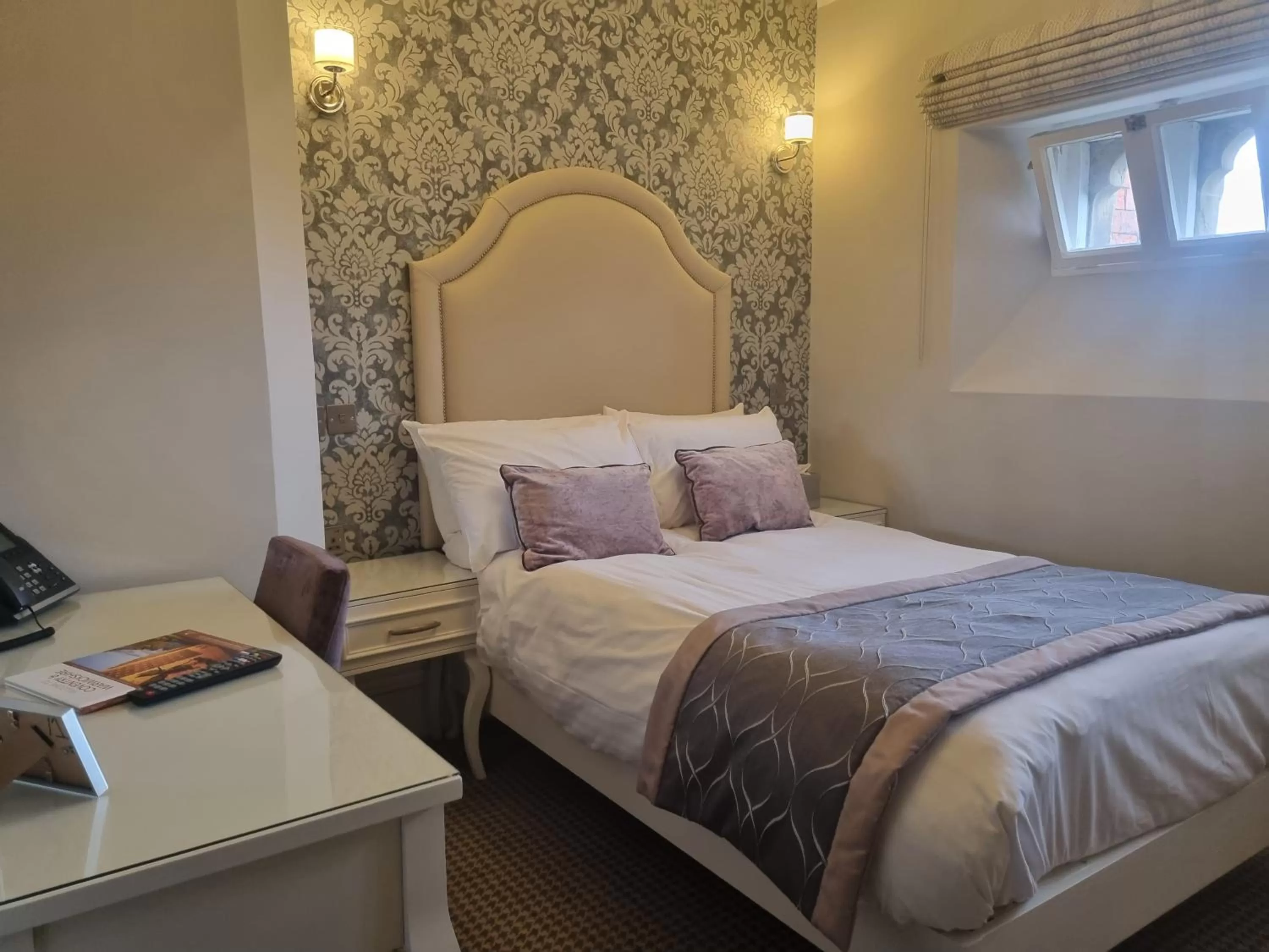 Bed in Wroxall Abbey Hotel