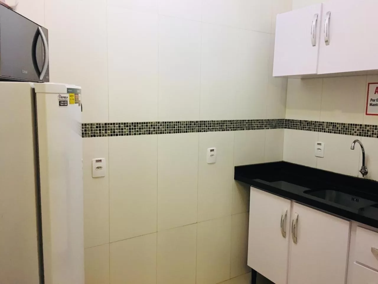 Kitchen or kitchenette in Hotel das Palmas