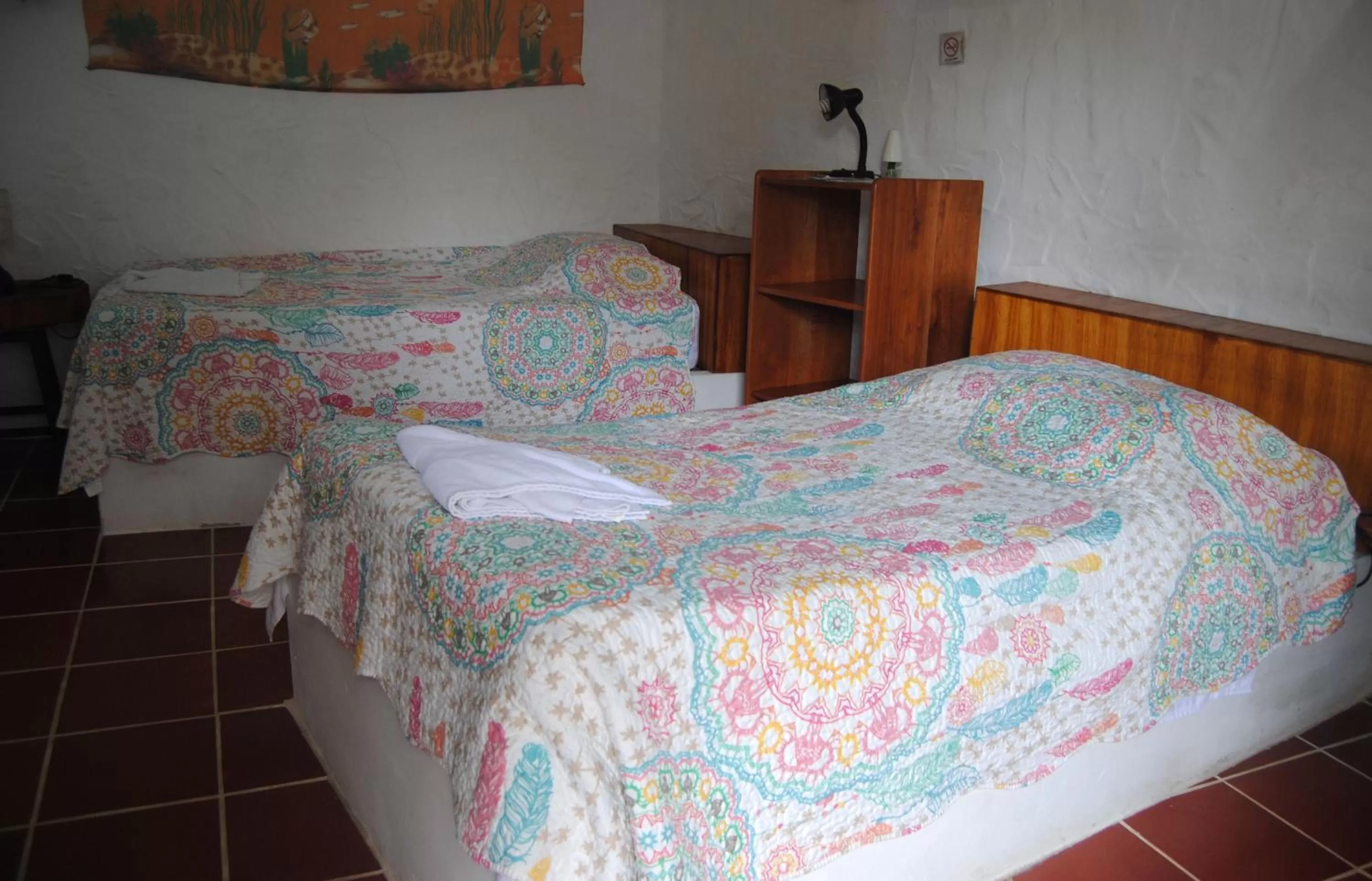 Bed in Hostal Galapagos by Bar de Beto