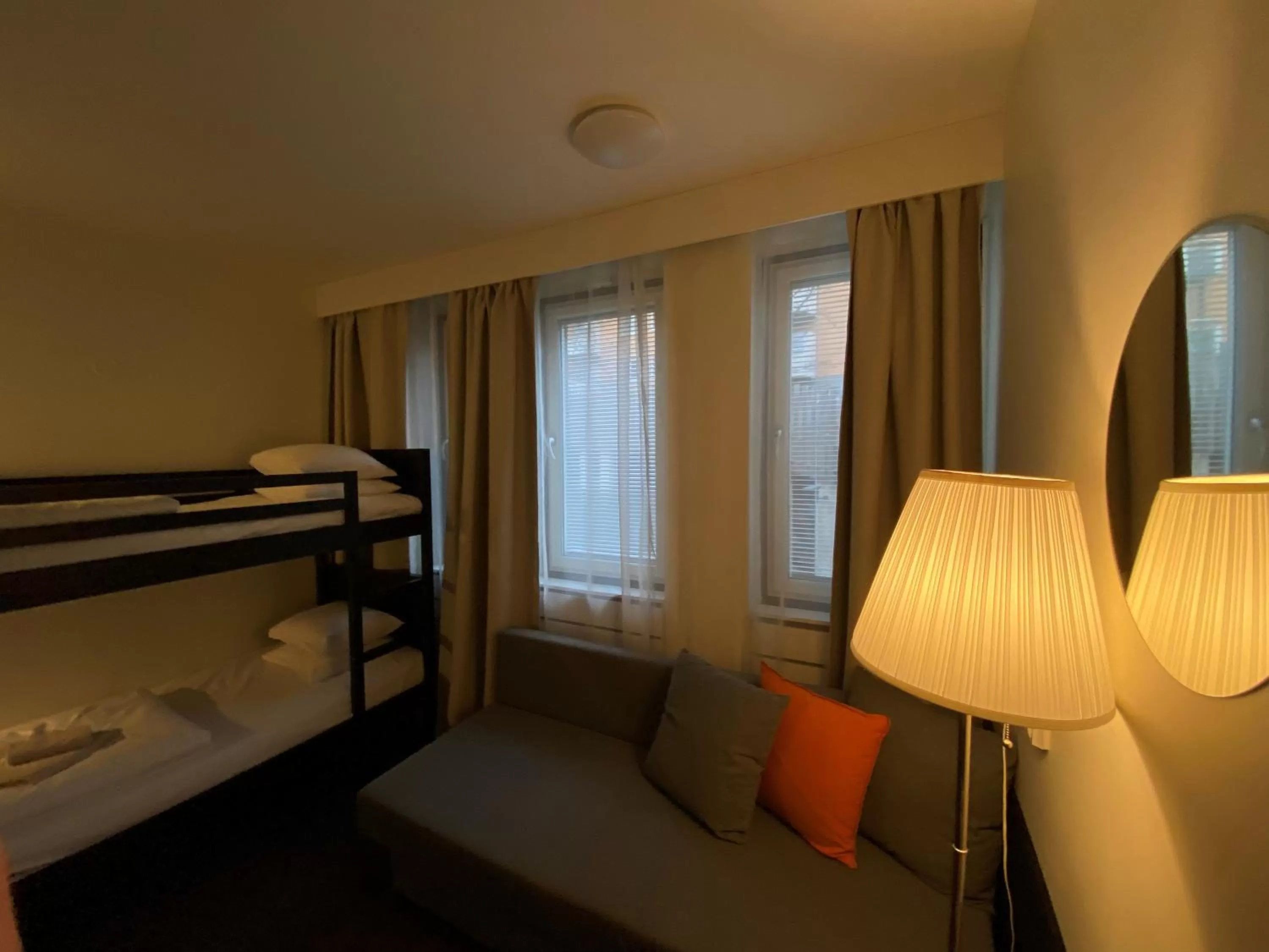 Quadruple Room with Private Bathroom Outside Room in Hall in LA Hotel