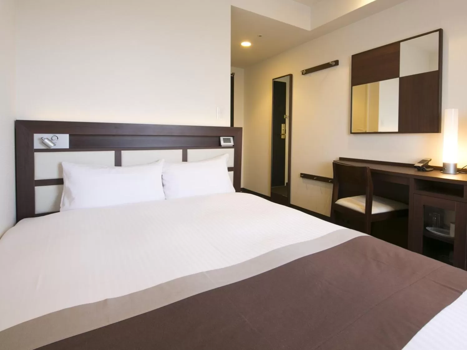 Bed in Urban Hotel Minami Kusatsu