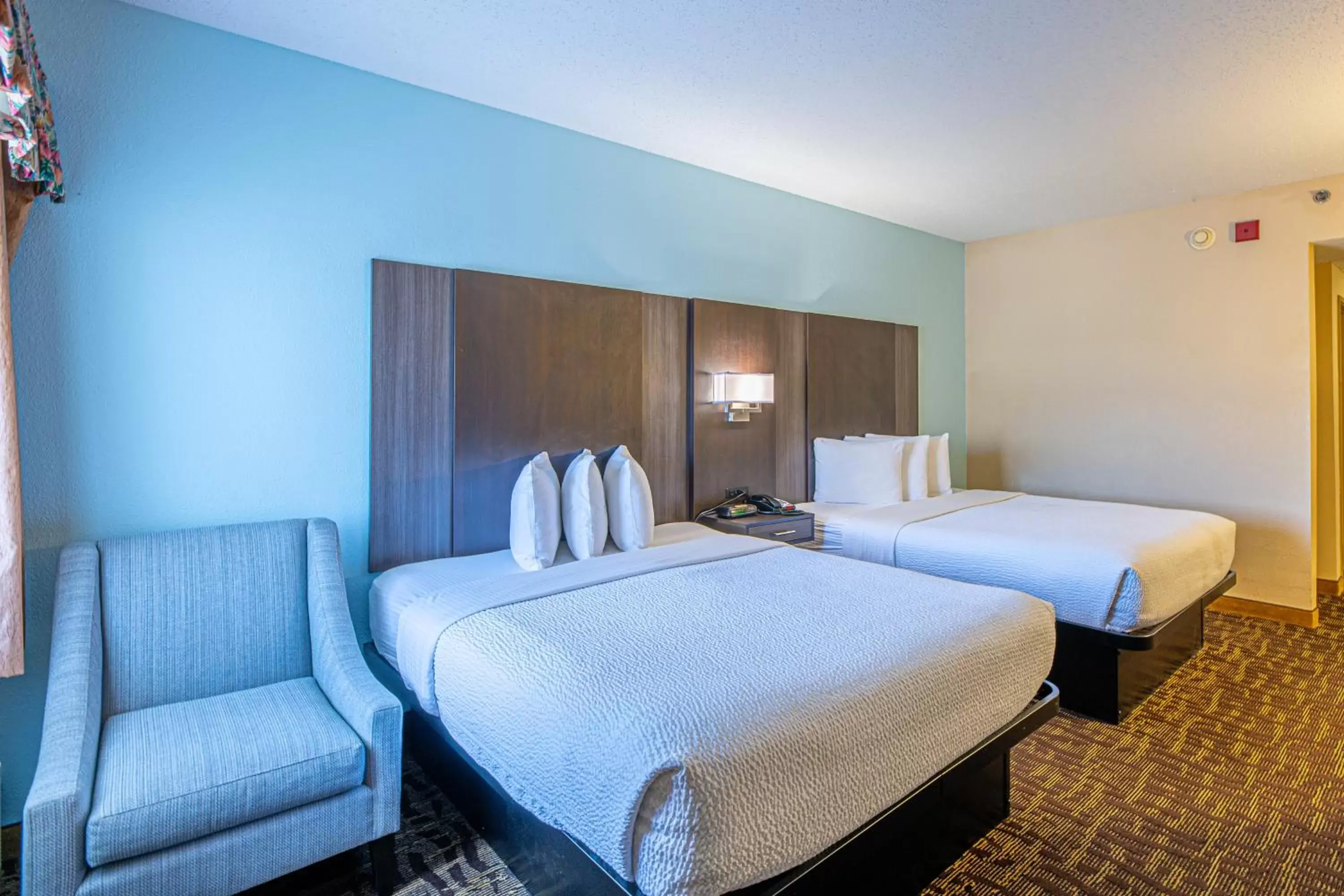 Queen Room with Two Queen Beds and Balcony in River Bend Inn - Pigeon Forge Queen Room with Two Queen Beds and Balcony in River Bend Inn - Pigeon Forge