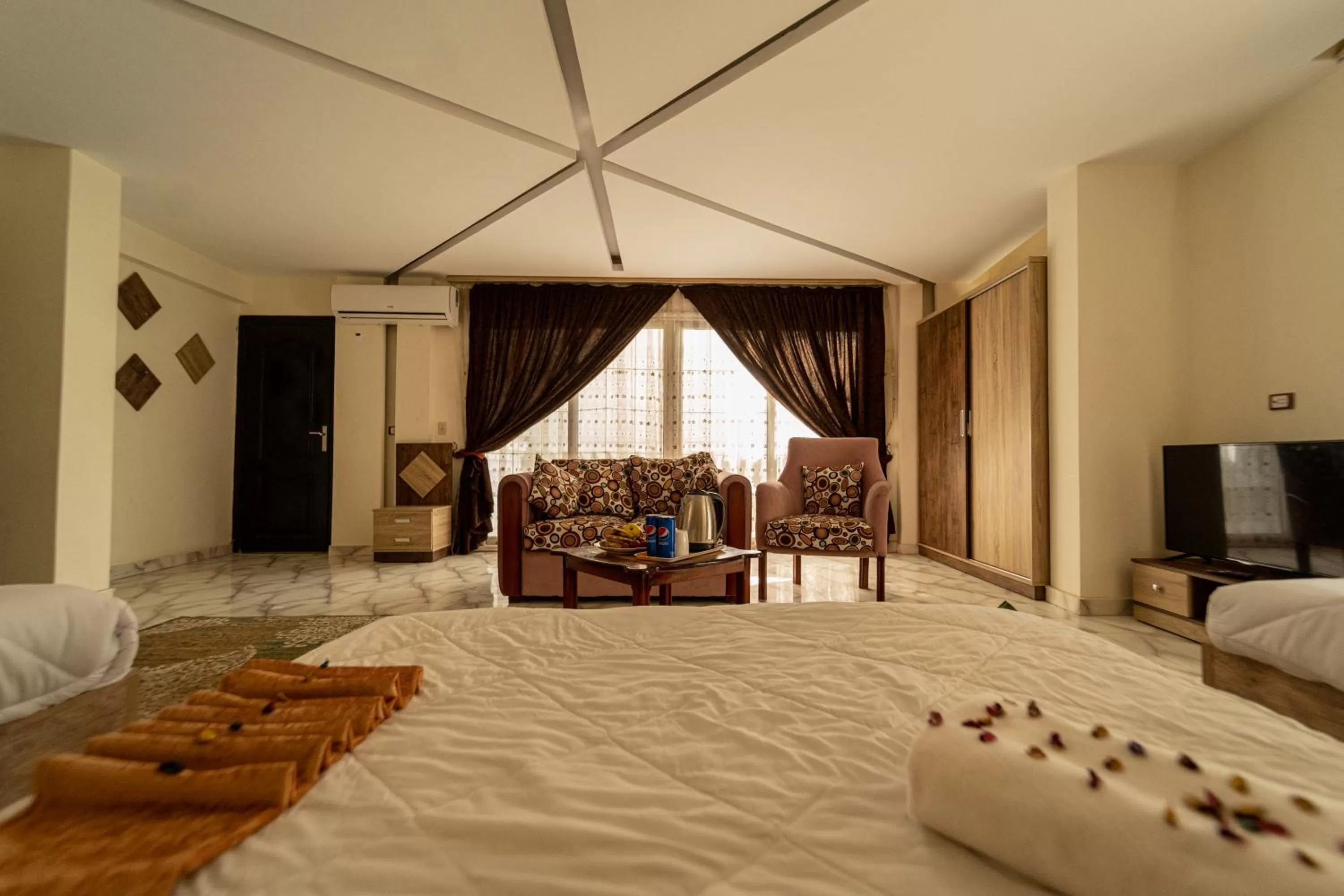 Bed in Gardenia Inn Hotel