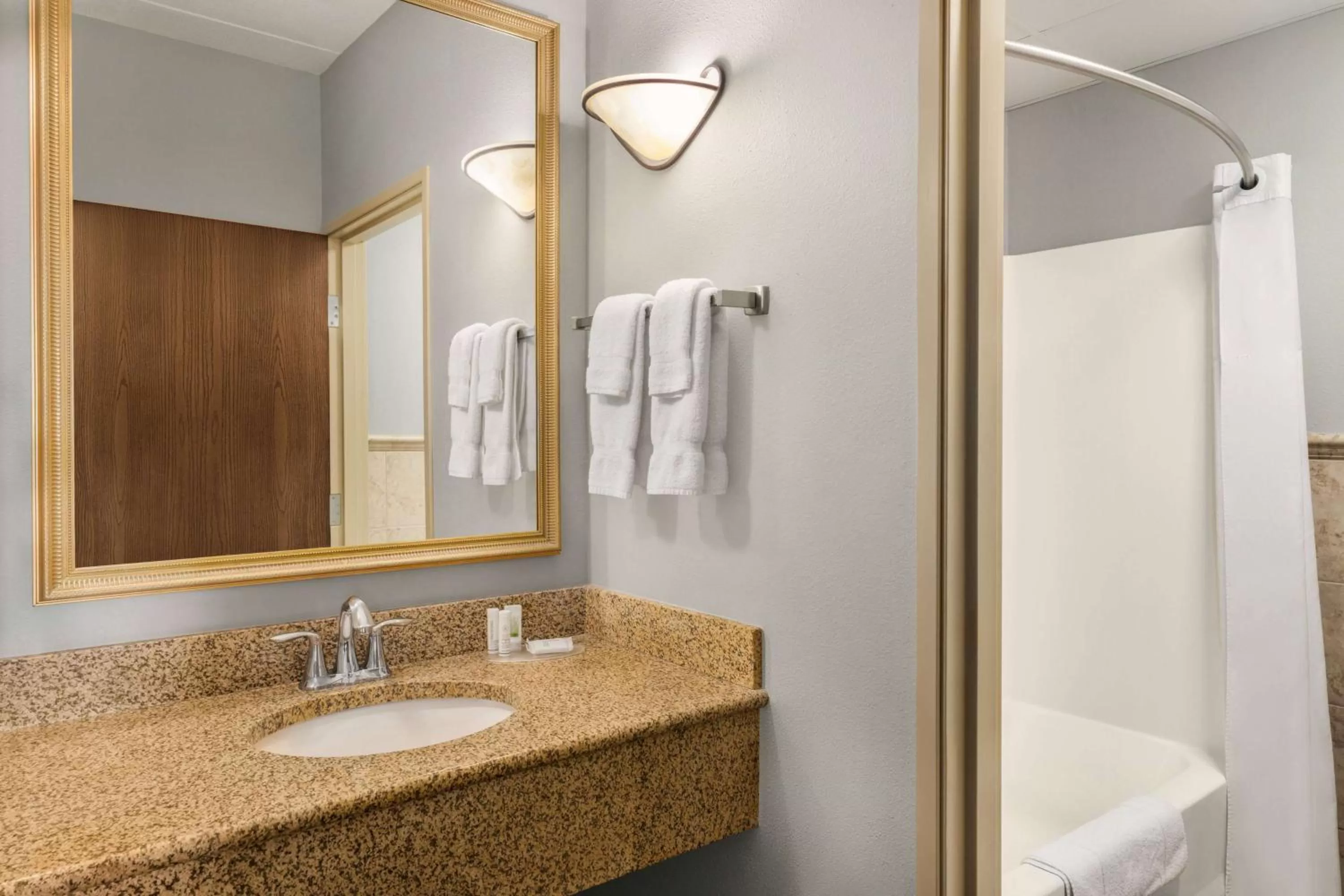 TV and multimedia in AmericInn by Wyndham Laramie Near University of Wyoming