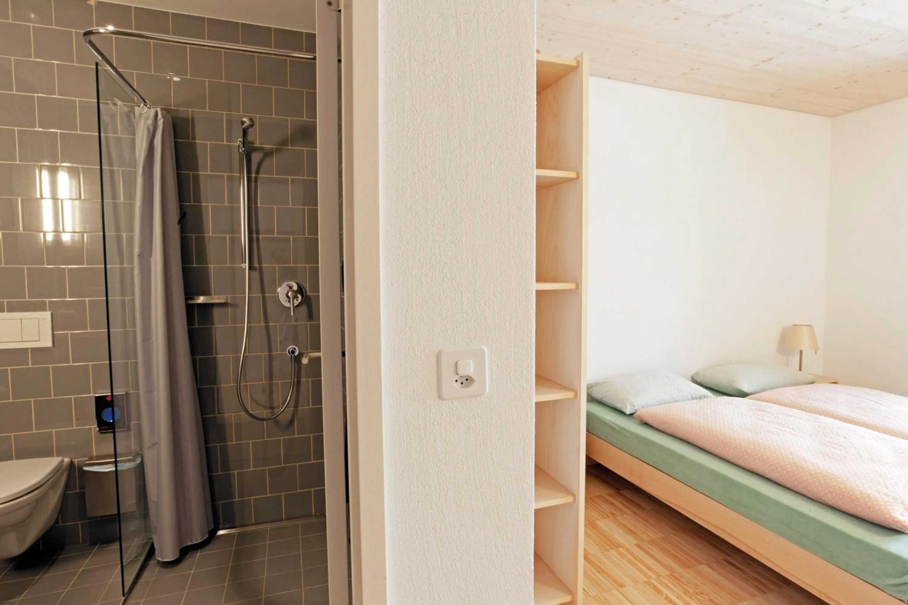Shower, Bed in St. Moritz Youth Hostel