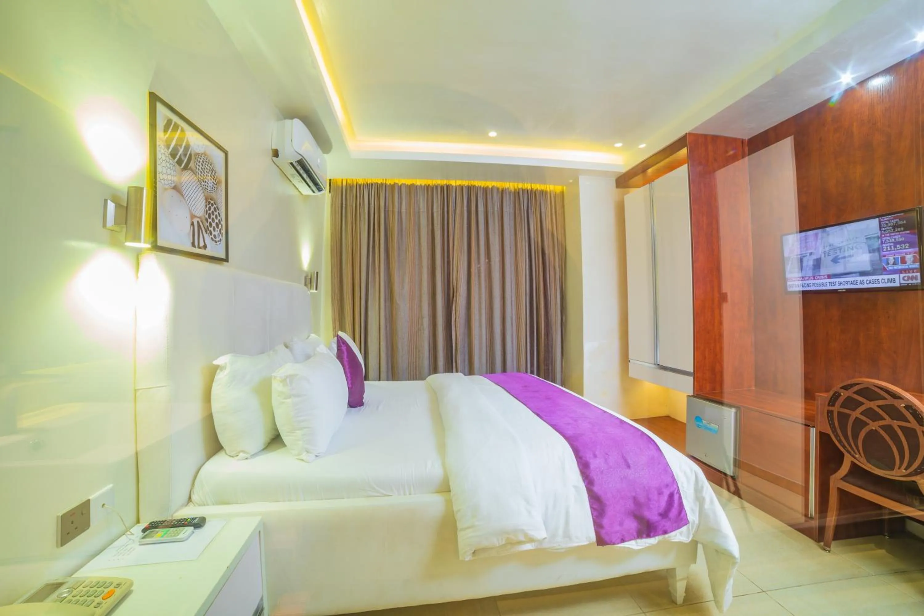 Photo of the whole room, Bed in The Grosvenor Suites Gwarinpa Abuja